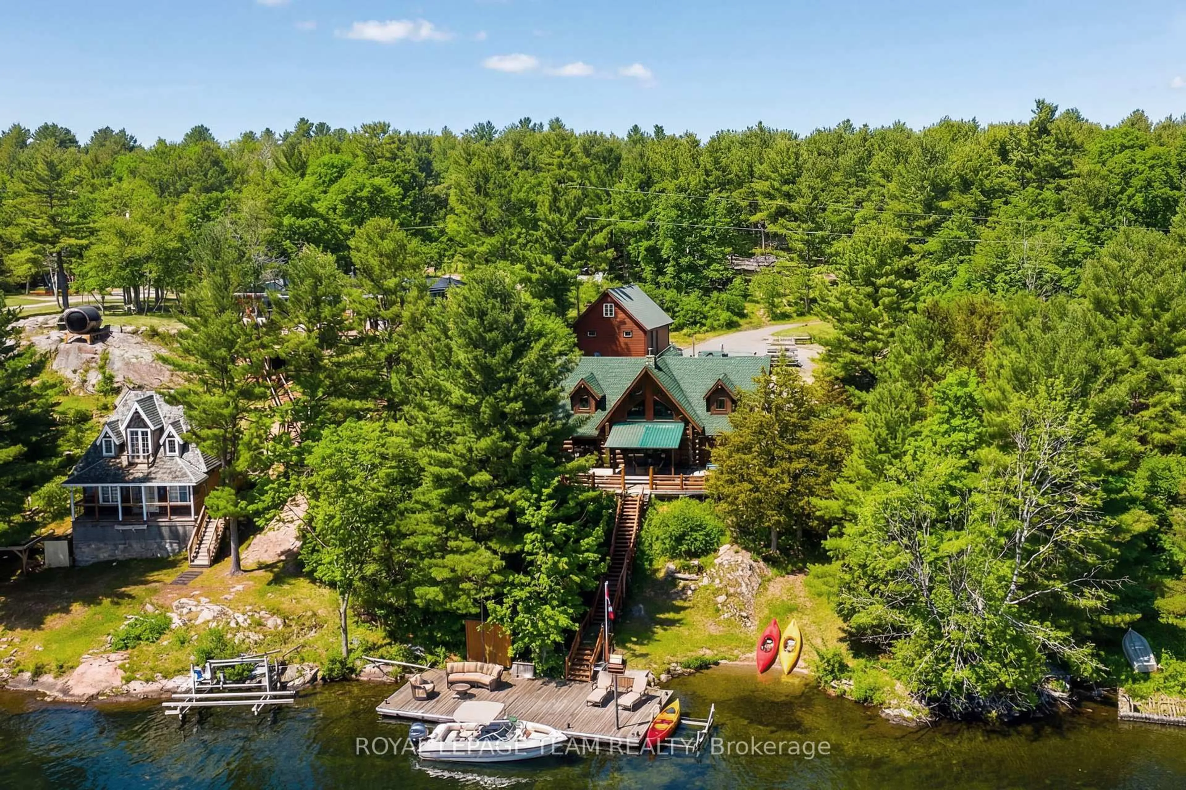 A pic from outside/outdoor area/front of a property/back of a property/a pic from drone, water/lake/river/ocean view for 781 Big Rideau North Shore Rd, Perth Ontario K7H 3C5