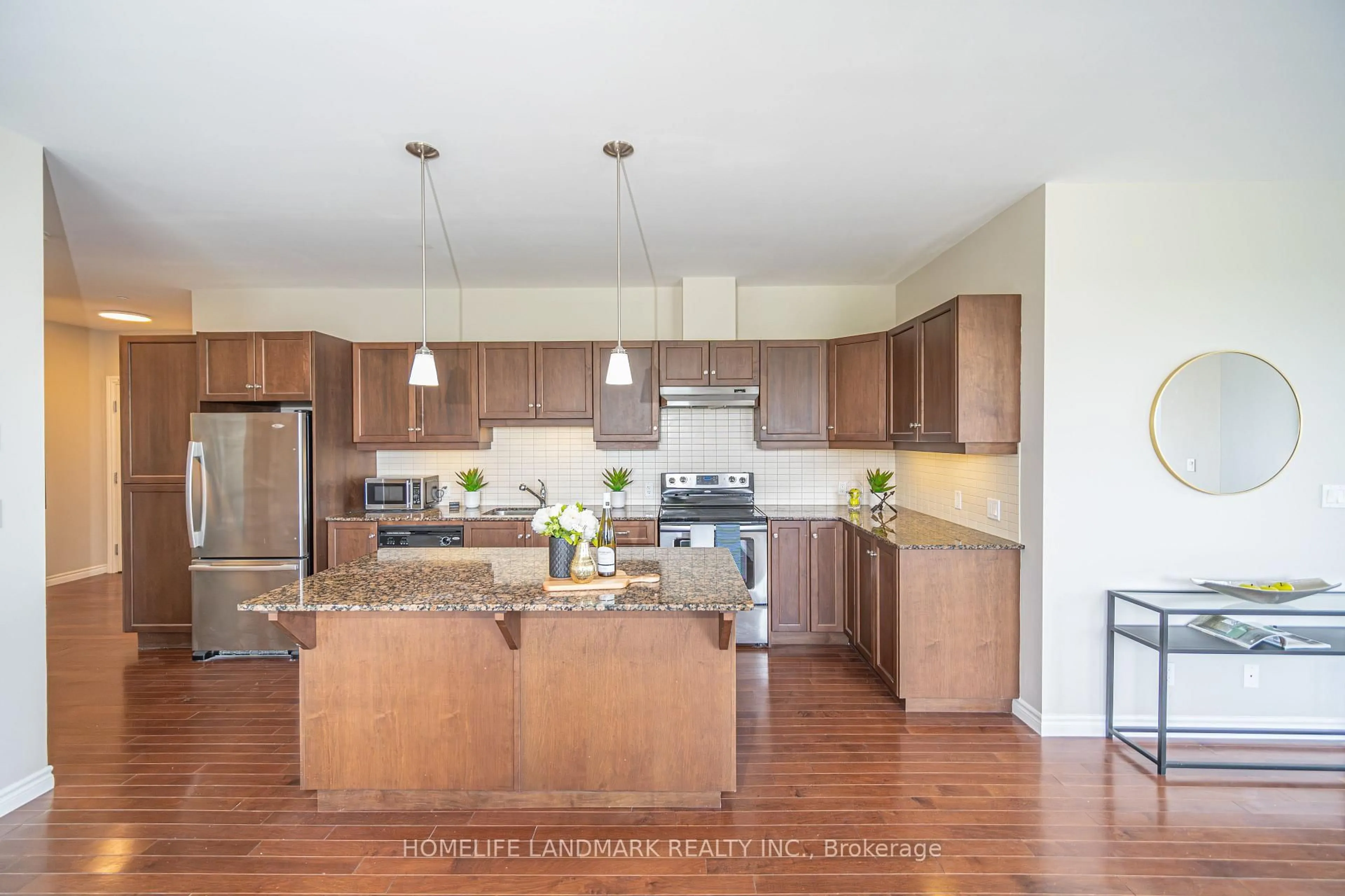 Open concept kitchen, wood/laminate floor for 223 Erb St #501, Waterloo Ontario N2L 0B3