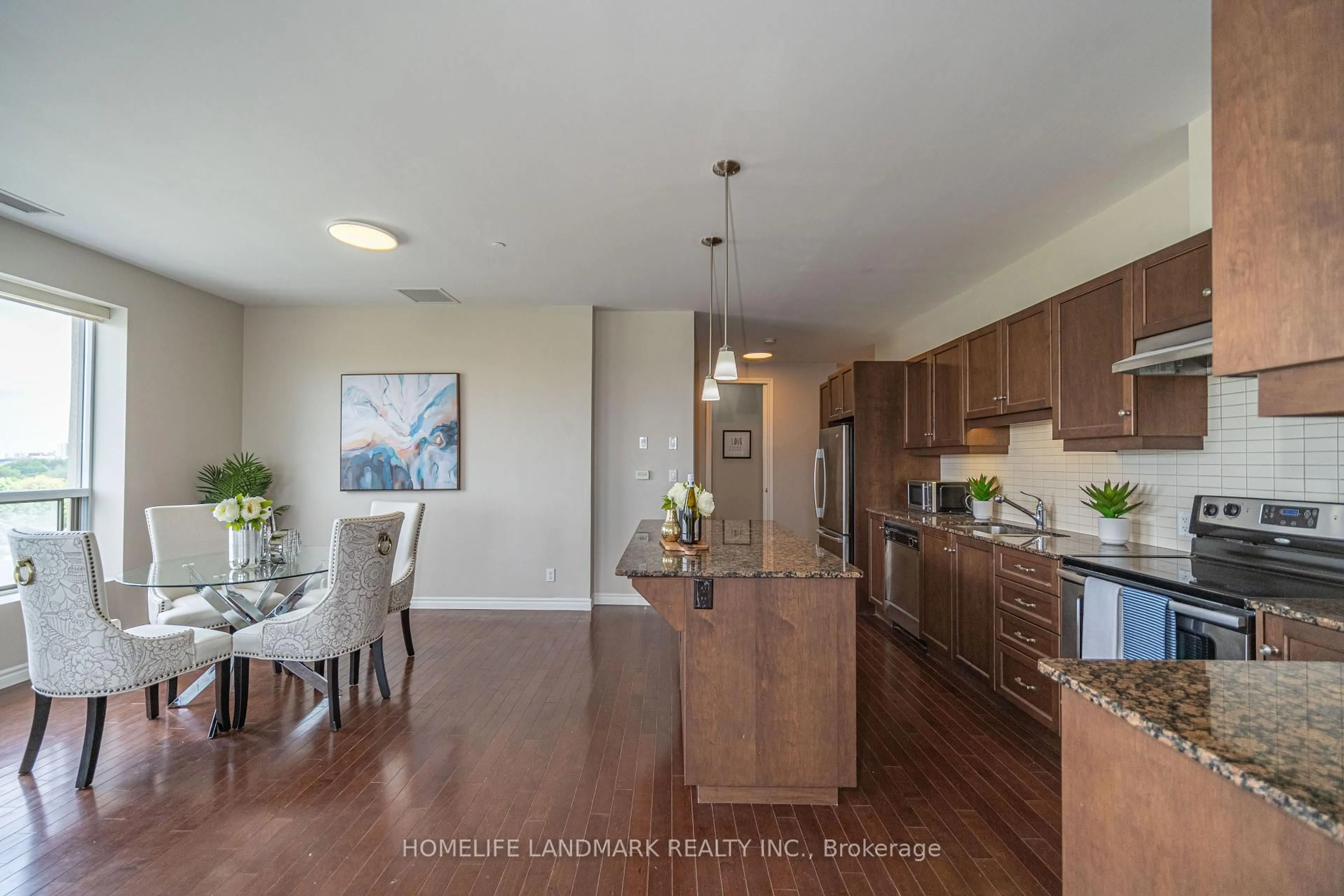 Open concept kitchen, wood/laminate floor for 223 Erb St #501, Waterloo Ontario N2L 0B3