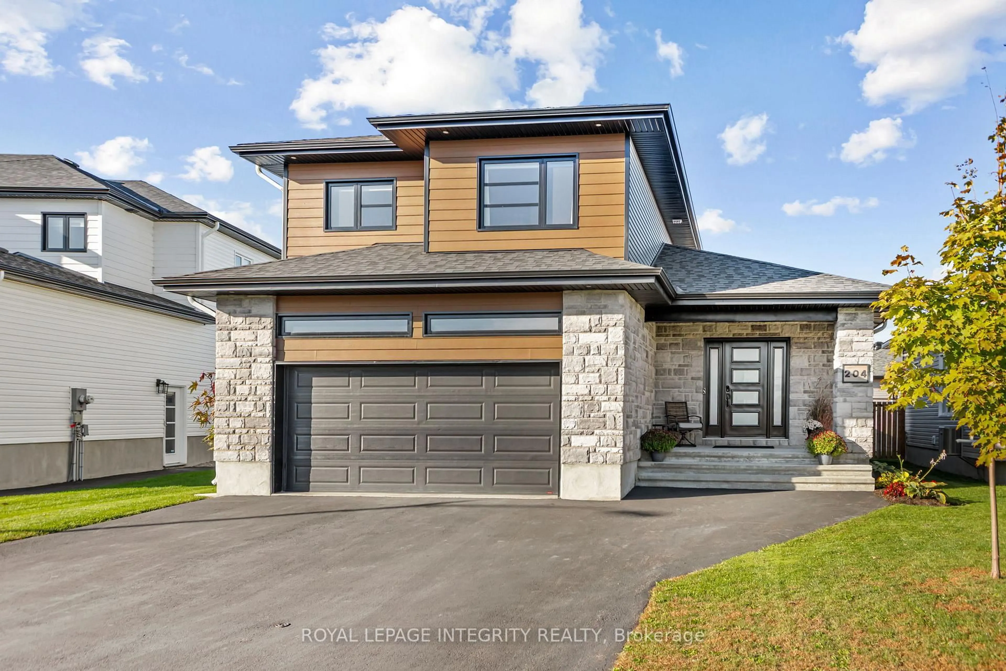 Home with brick exterior material, street for 204 Hybrid St, Russell Ontario K0A 1W0