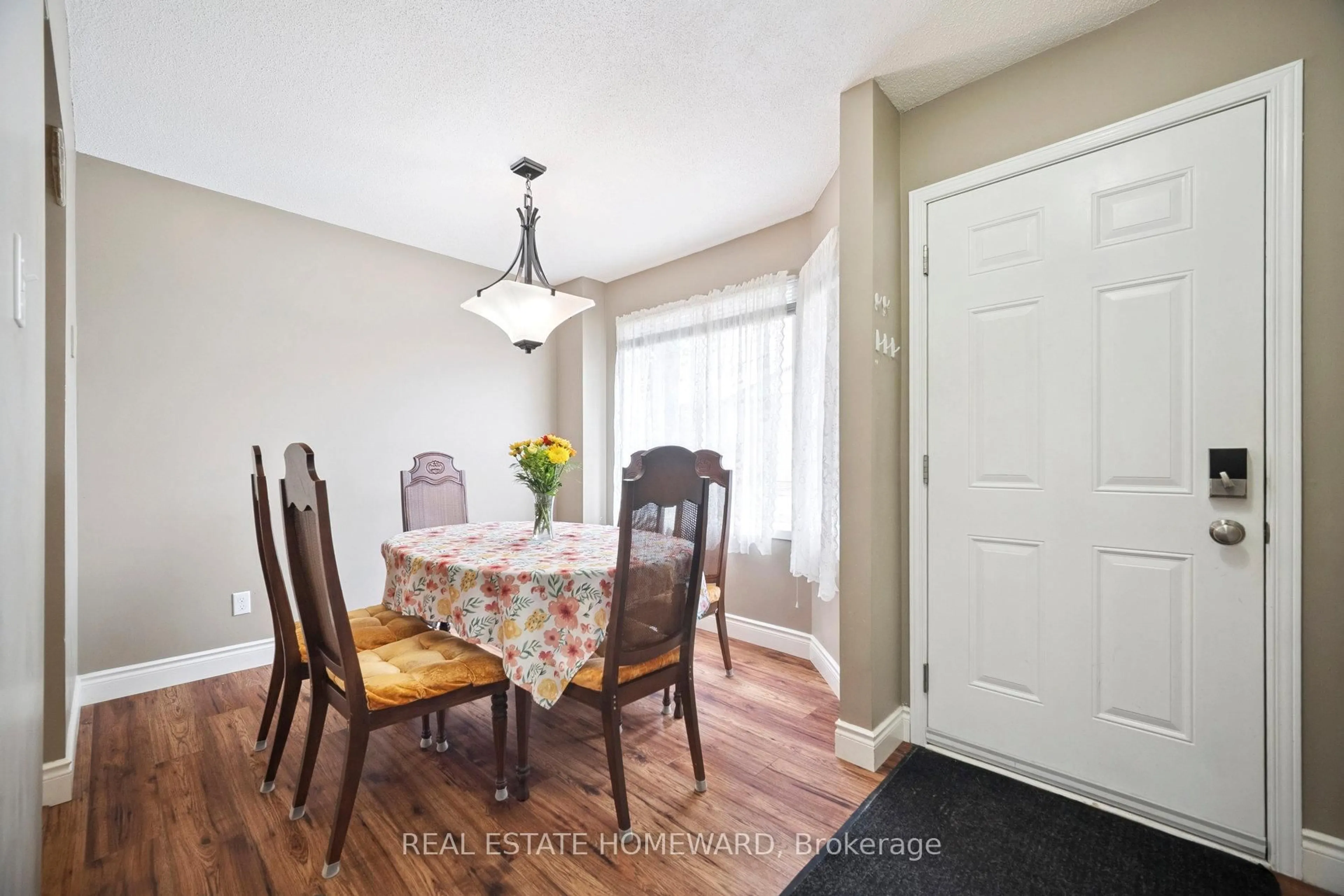 Dining room, wood/laminate floor for 1093 Nellis St #12, Woodstock Ontario N4T 1P5
