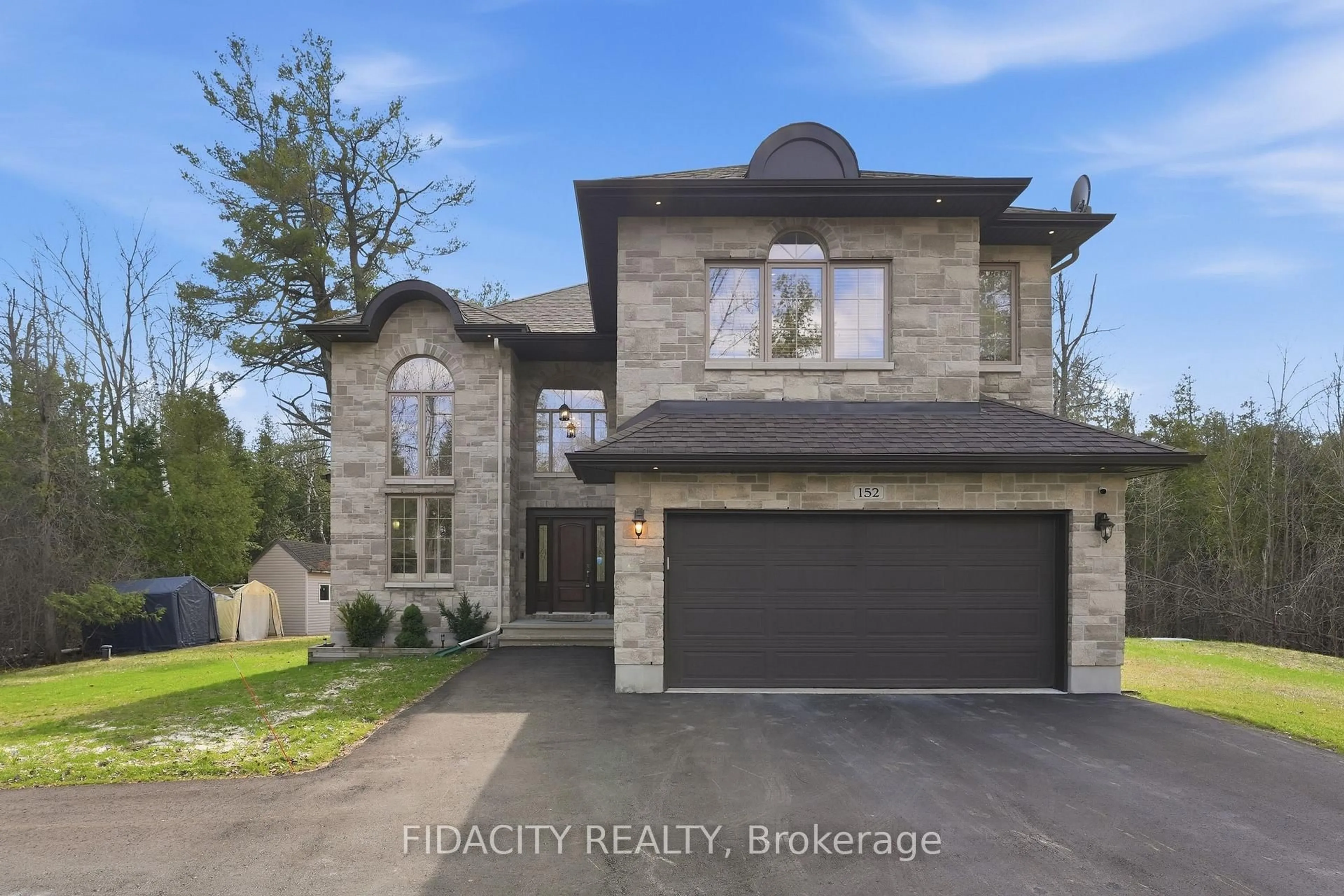 Home with brick exterior material, street for 152 Wilbert Cox Dr, Carp Ontario K0A 1L0