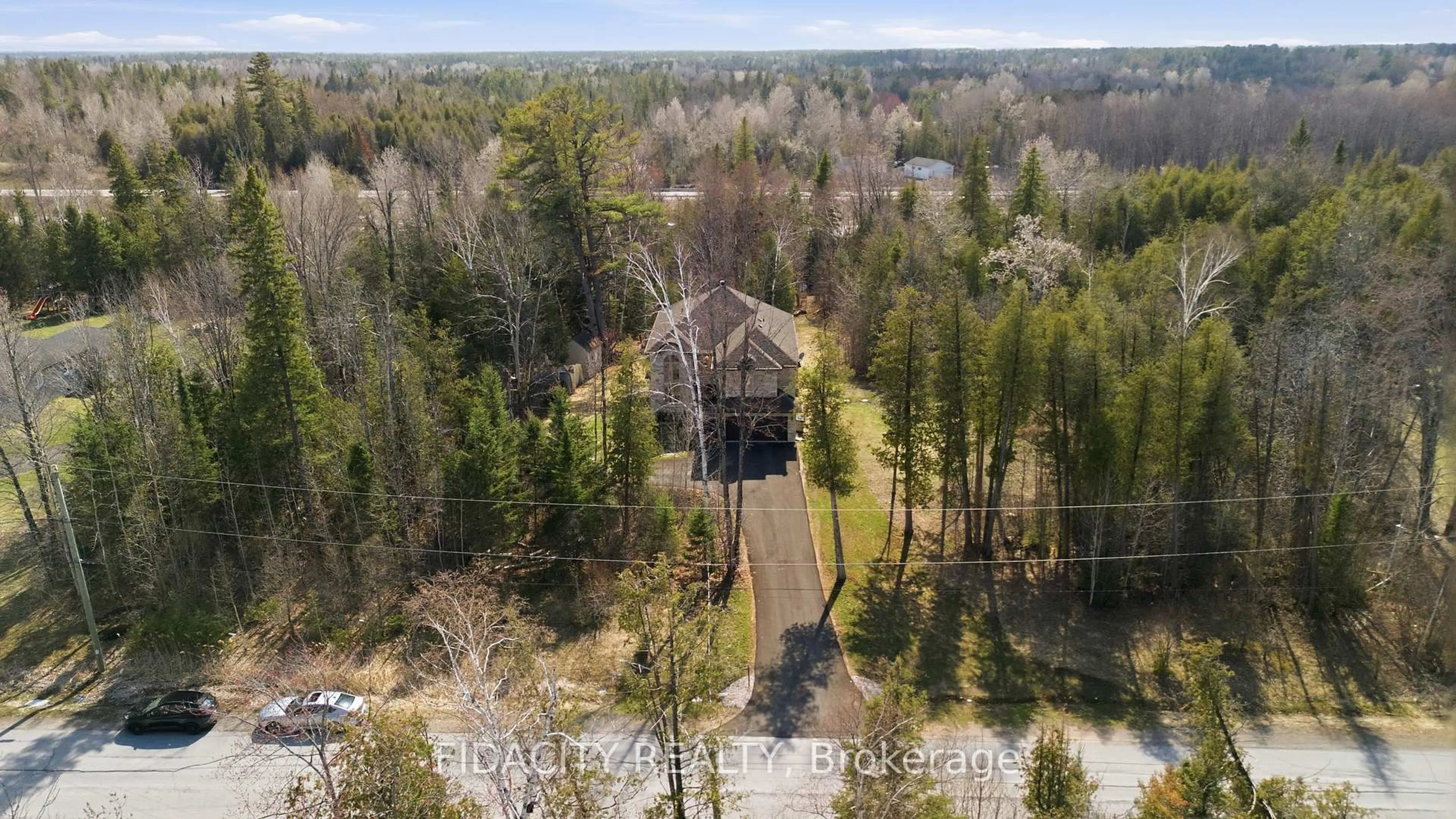 A pic from outside/outdoor area/front of a property/back of a property/a pic from drone, forest/trees view for 152 Wilbert Cox Dr, Carp Ontario K0A 1L0