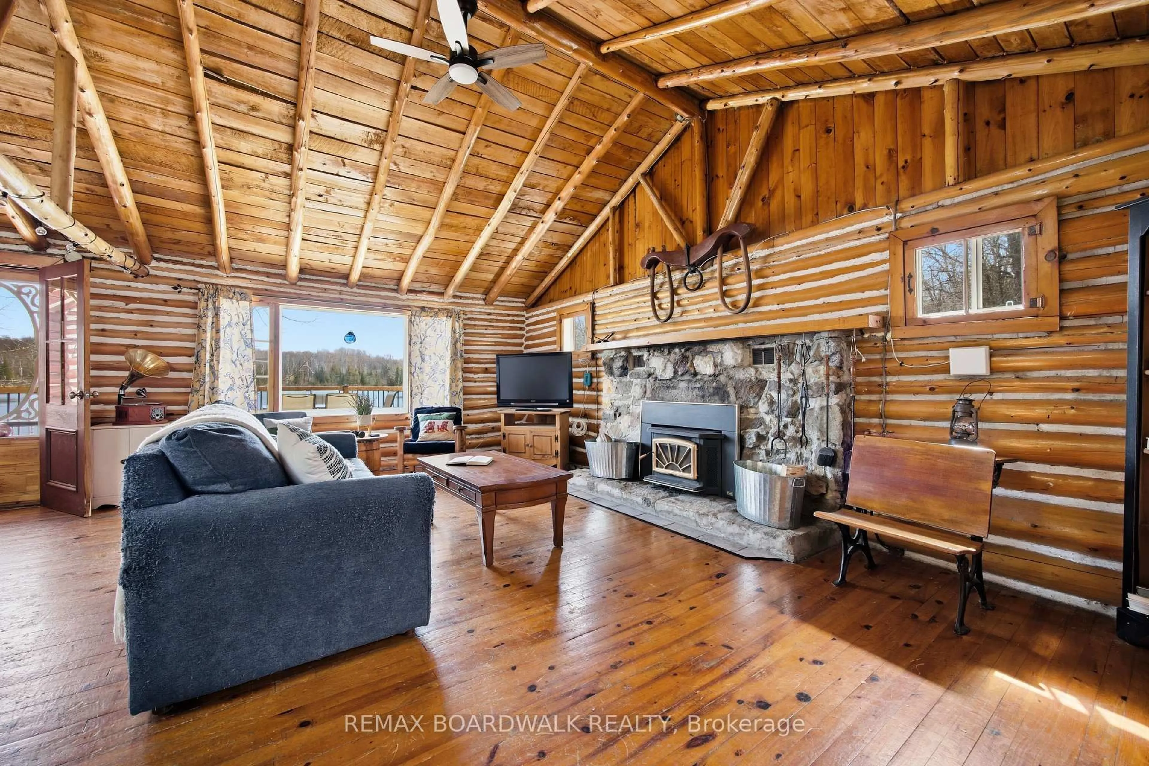 Living room with furniture, wood/laminate floor for 5039 Bula Lane, Perth Ontario K7H 3C7