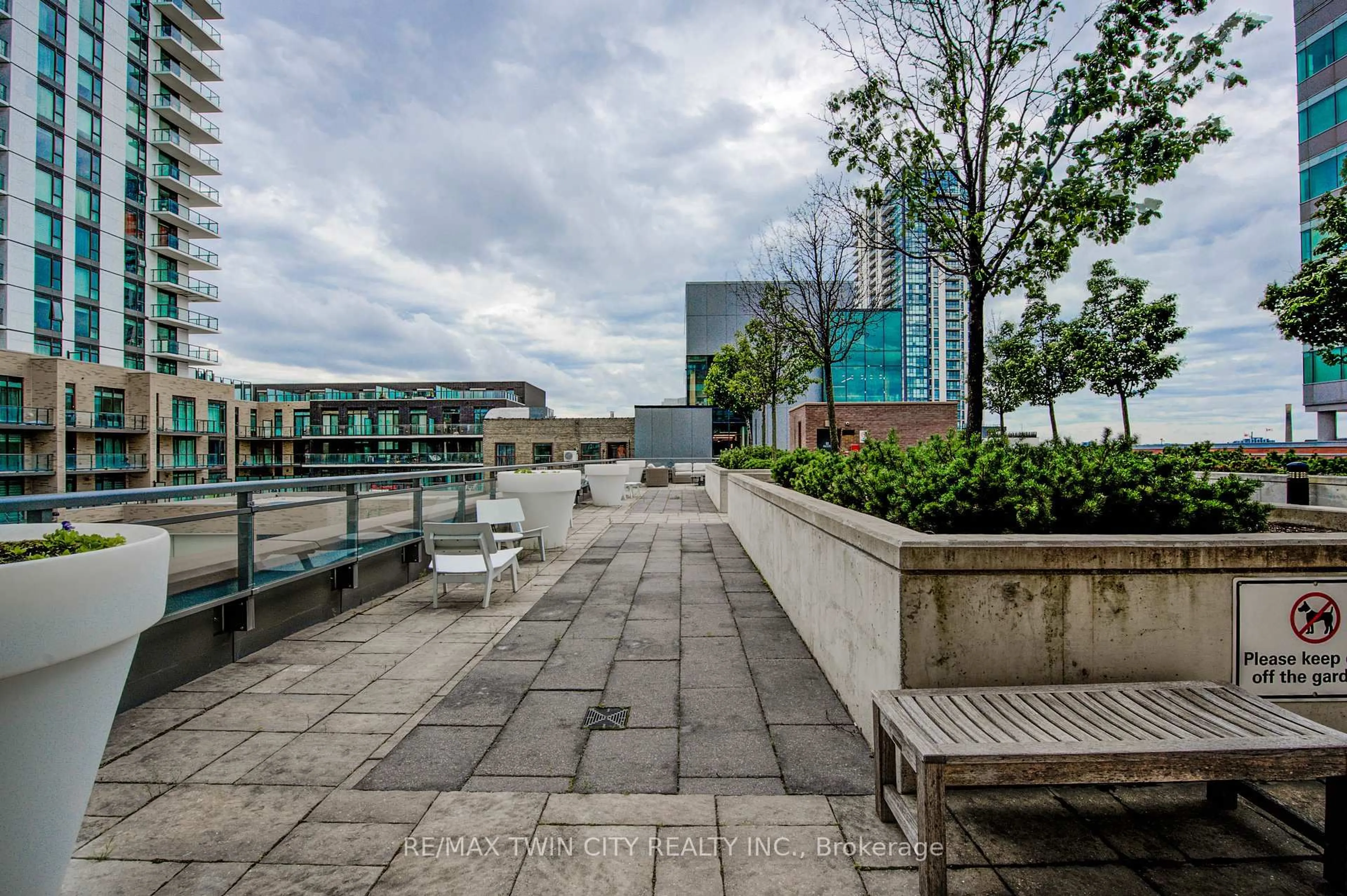 Patio, city buildings view from balcony for 85 Duke St #112, Kitchener Ontario N2H 0B7
