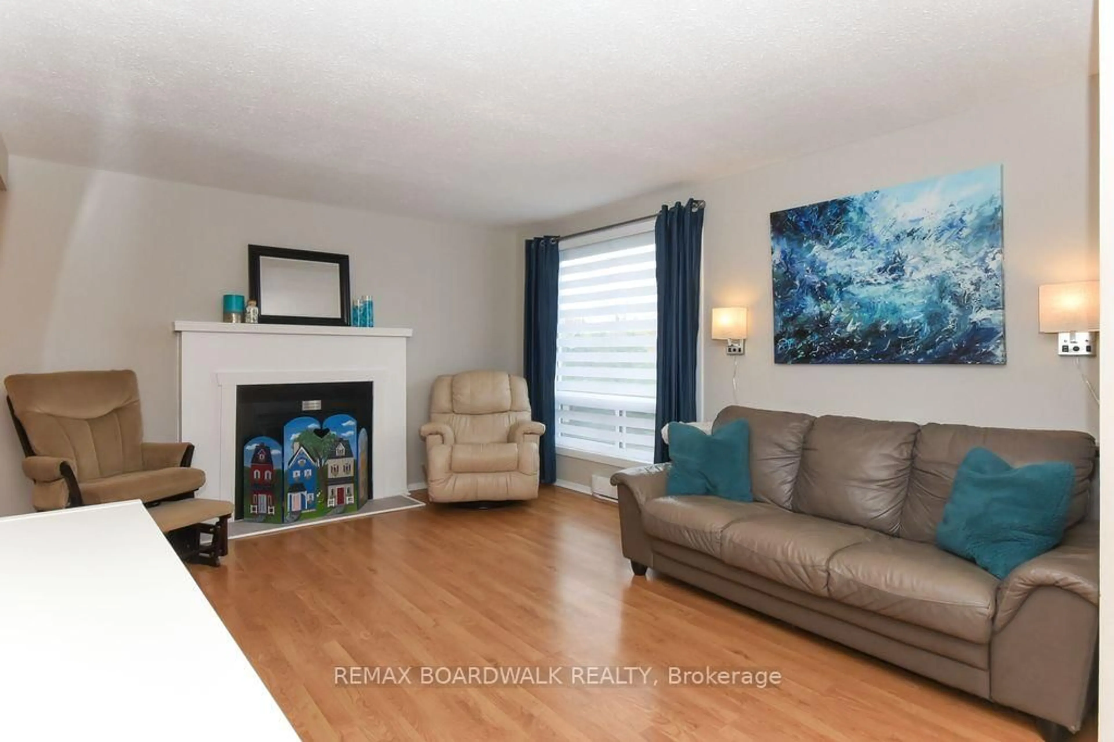 Living room with furniture, wood/laminate floor for 758 St-Andre Dr, Ottawa Ontario K1C 4S6
