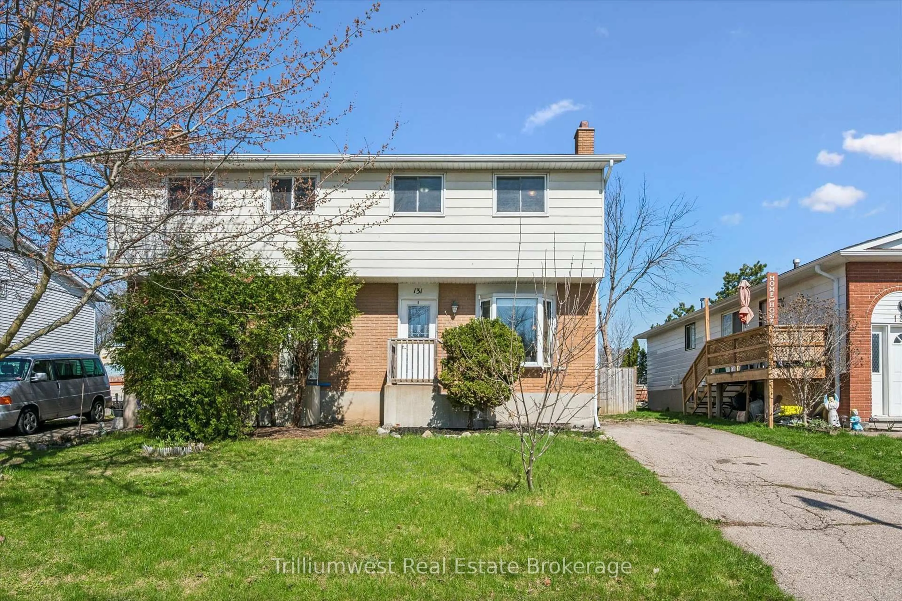 Home with vinyl exterior material, street for 131 Sanderson Dr, Guelph Ontario N1H 7K1