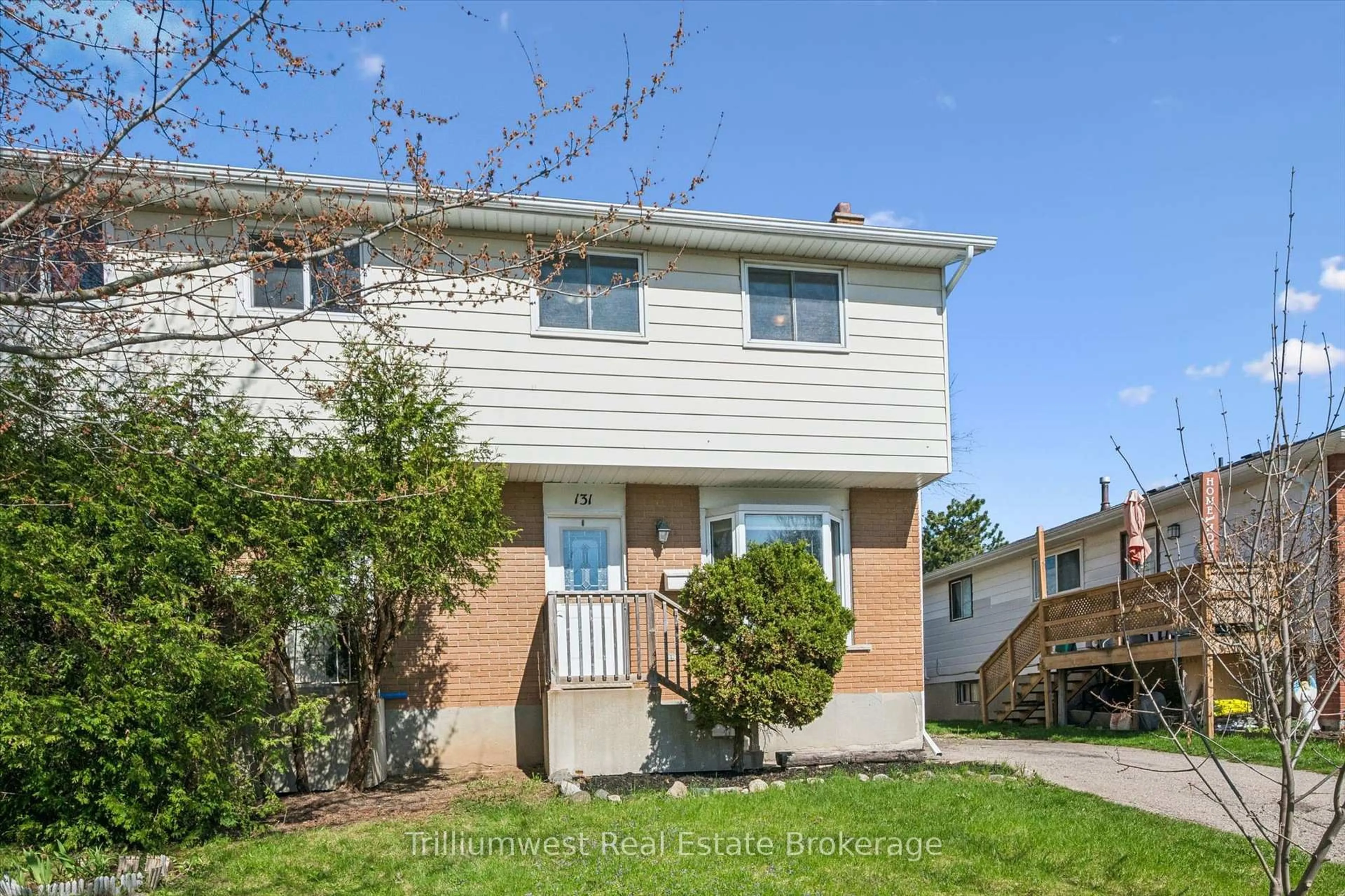 Home with vinyl exterior material, street for 131 Sanderson Dr, Guelph Ontario N1H 7K1