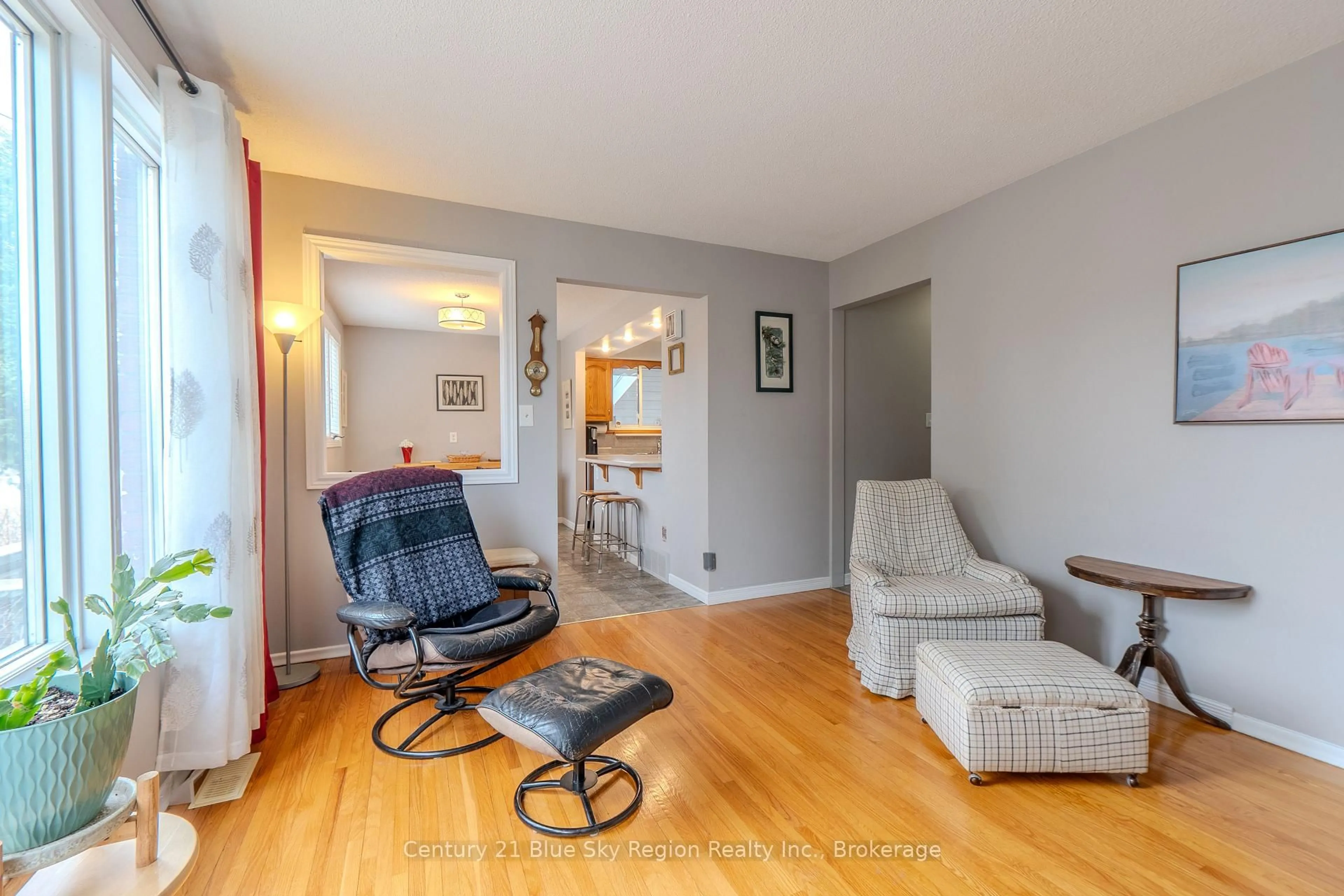 Living room with furniture, wood/laminate floor for 755 Danforth Ave, Sudbury Remote Area Ontario P3A 3Y7