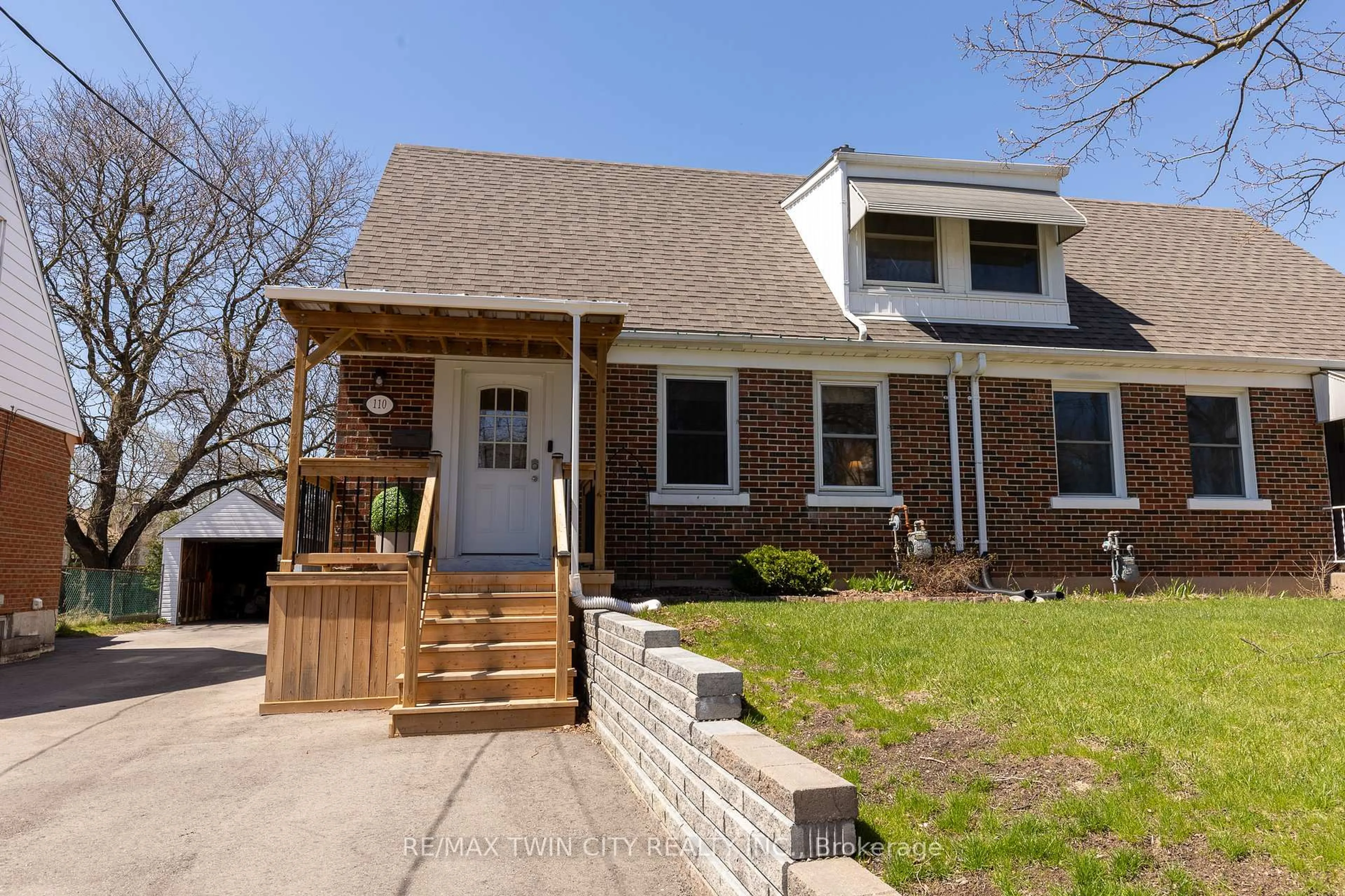 Home with brick exterior material, street for 110 Lorne Cres, Kitchener Ontario N2M 3Y5