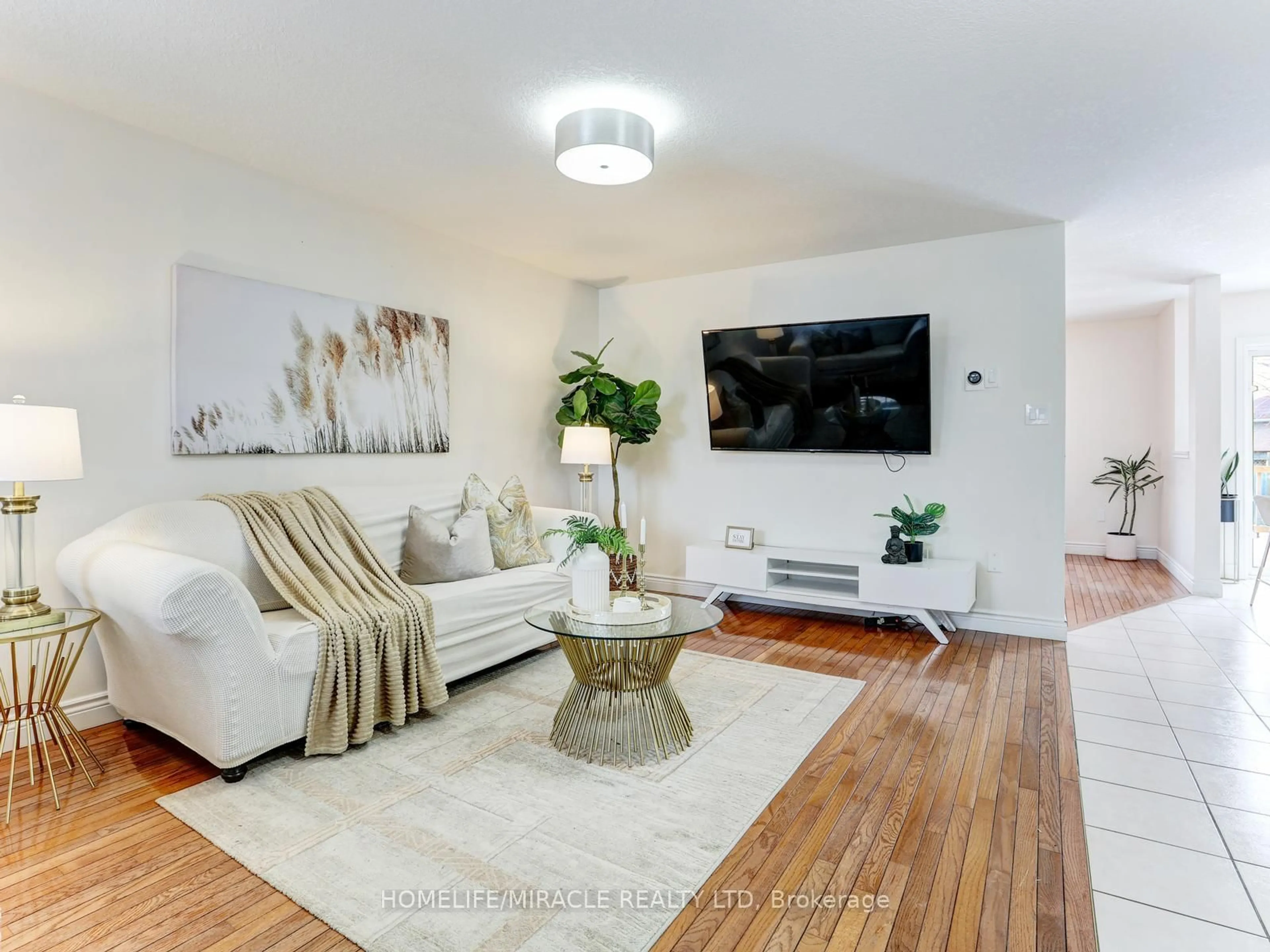 Living room with furniture, wood/laminate floor for 154 Deerpath Dr, Guelph Ontario N1K 1W9