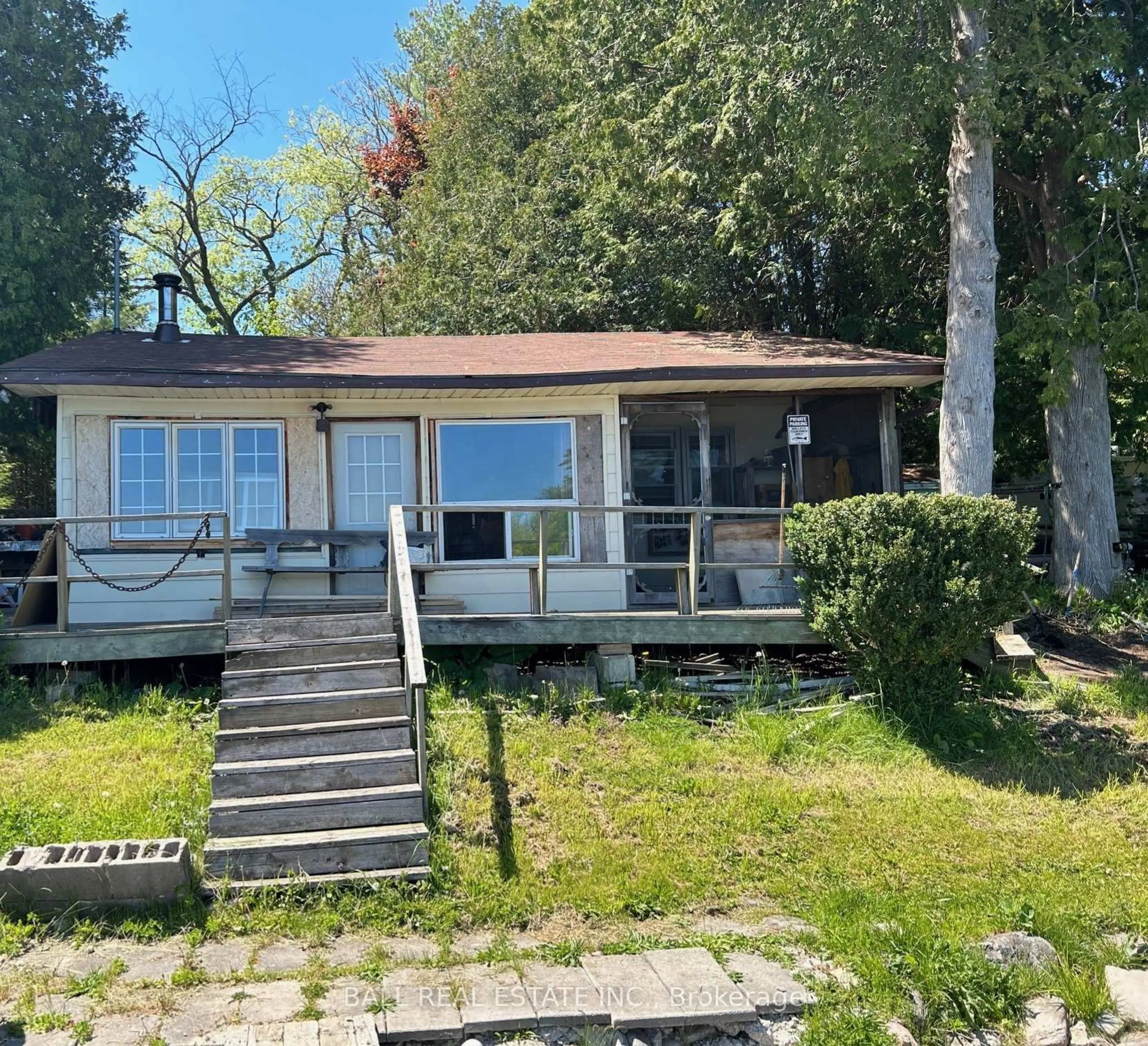 A pic from outside/outdoor area/front of a property/back of a property/a pic from drone, water/lake/river/ocean view for 2095 Wilson Lane, Selwyn Ontario K0L 3G0