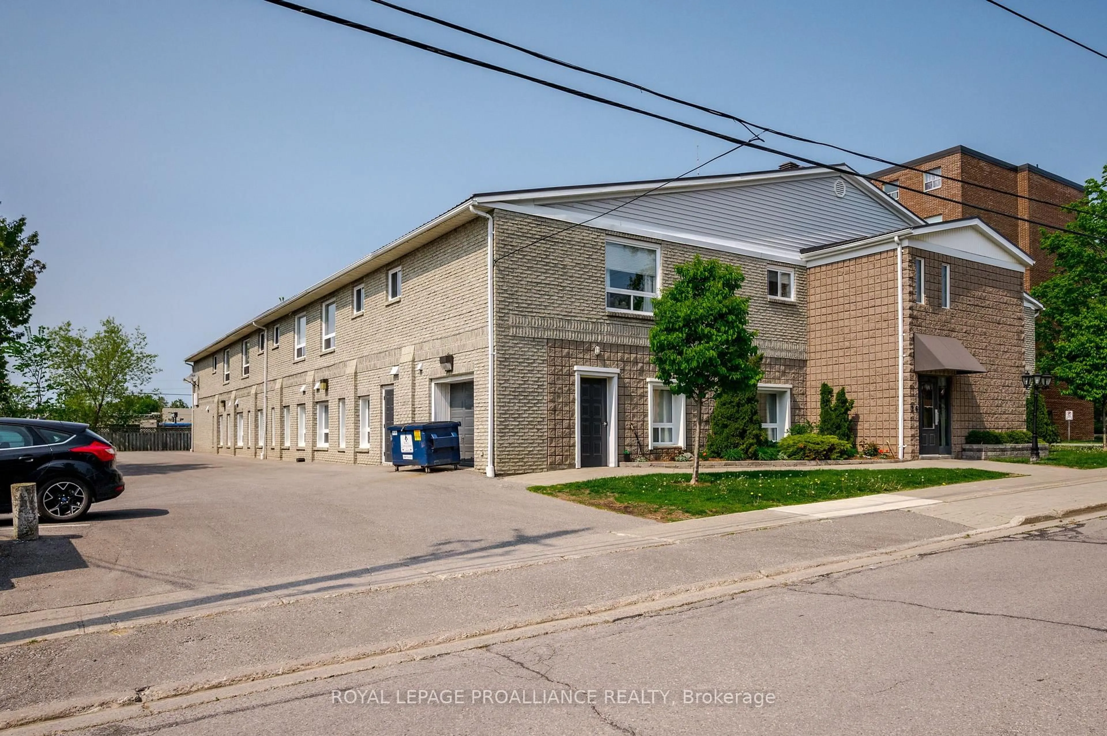 A pic from outside/outdoor area/front of a property/back of a property/a pic from drone, street for 26 Spencer St #212, Cobourg Ontario K9A 1C2