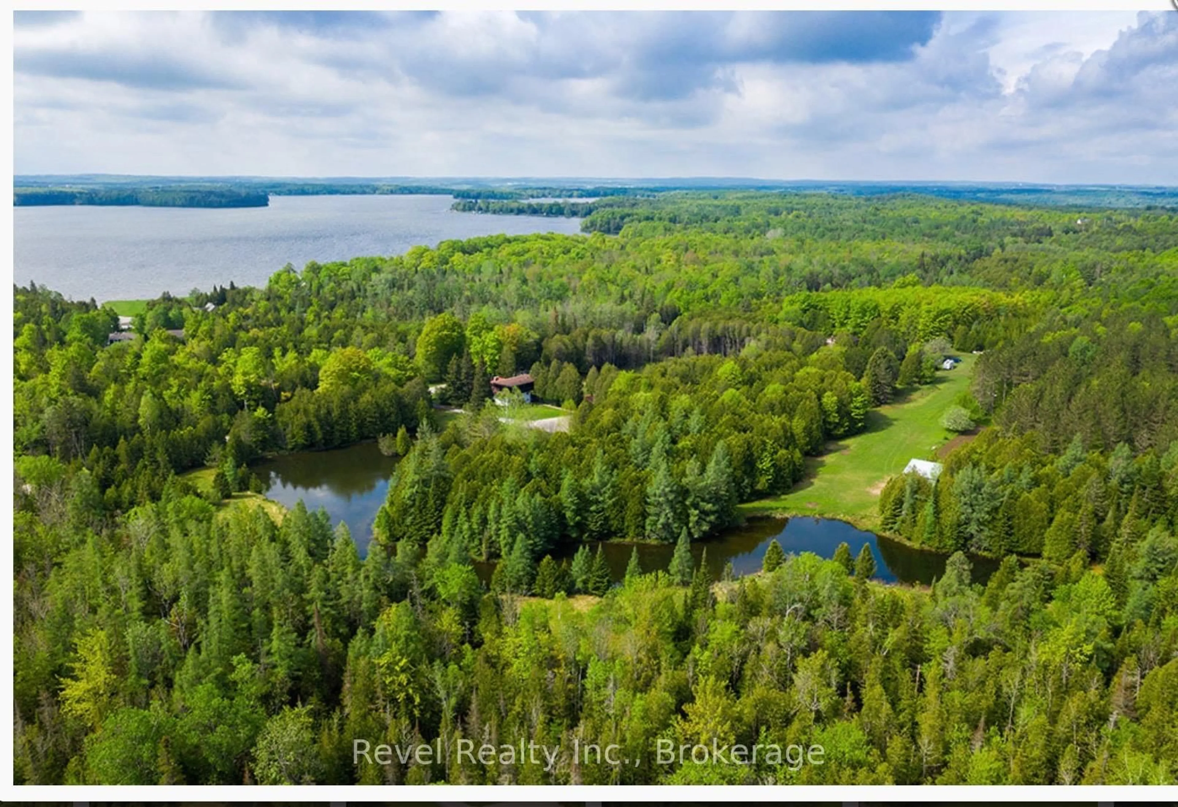 A pic from outside/outdoor area/front of a property/back of a property/a pic from drone, water/lake/river/ocean view for 466615 12th B Concession, Grey Highlands Ontario N0C 1E0
