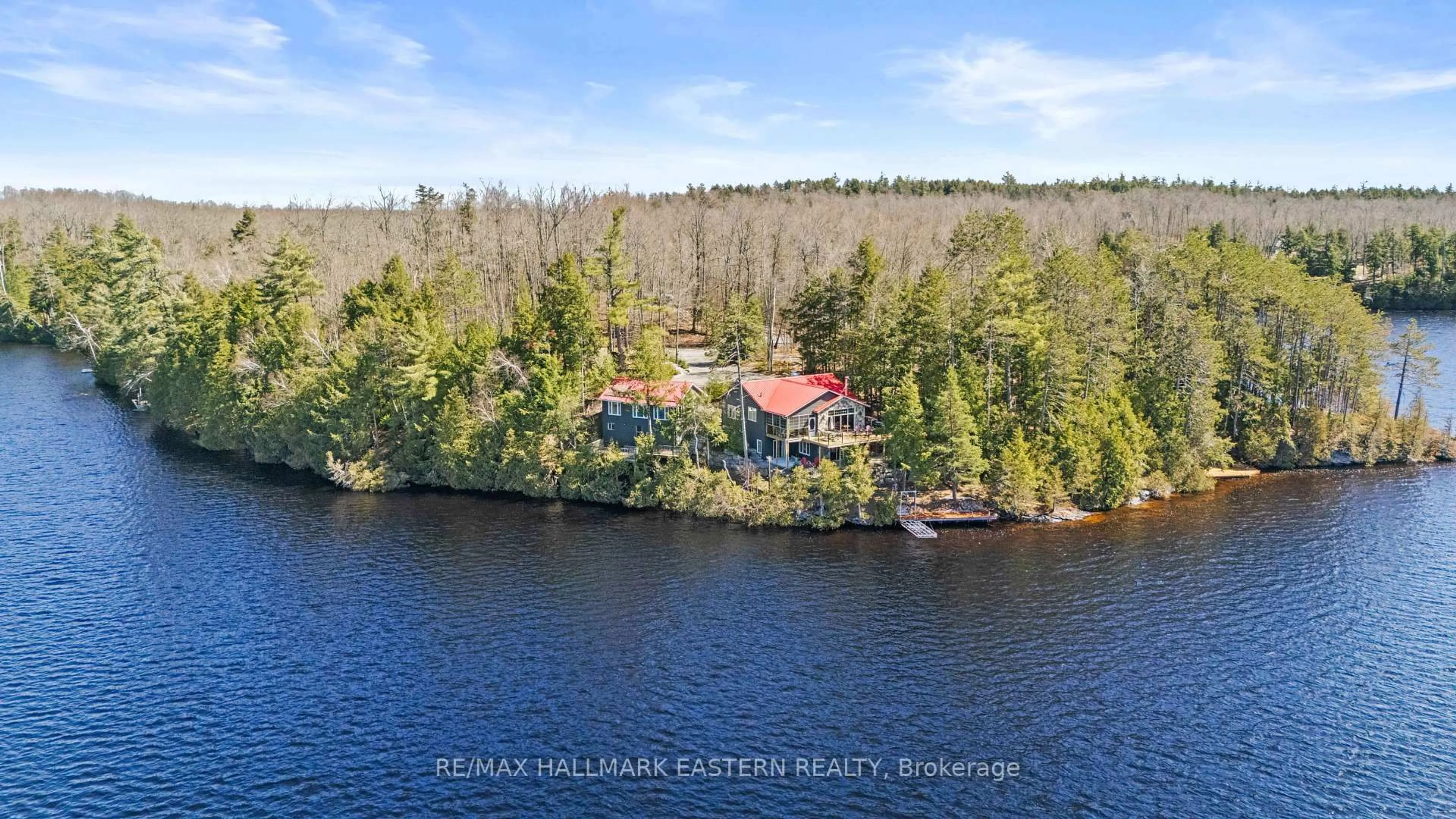 A pic from outside/outdoor area/front of a property/back of a property/a pic from drone, water/lake/river/ocean view for 66 Fire Route 209, Trent Lakes Ontario K0L 1J0