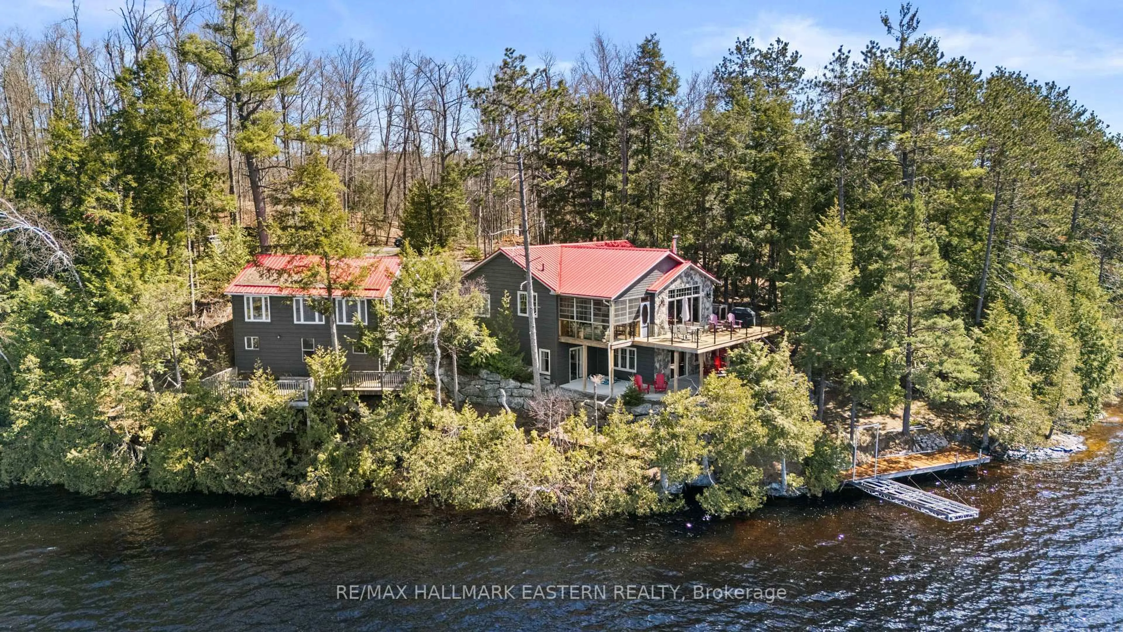 A pic from outside/outdoor area/front of a property/back of a property/a pic from drone, water/lake/river/ocean view for 66 Fire Route 209, Trent Lakes Ontario K0L 1J0