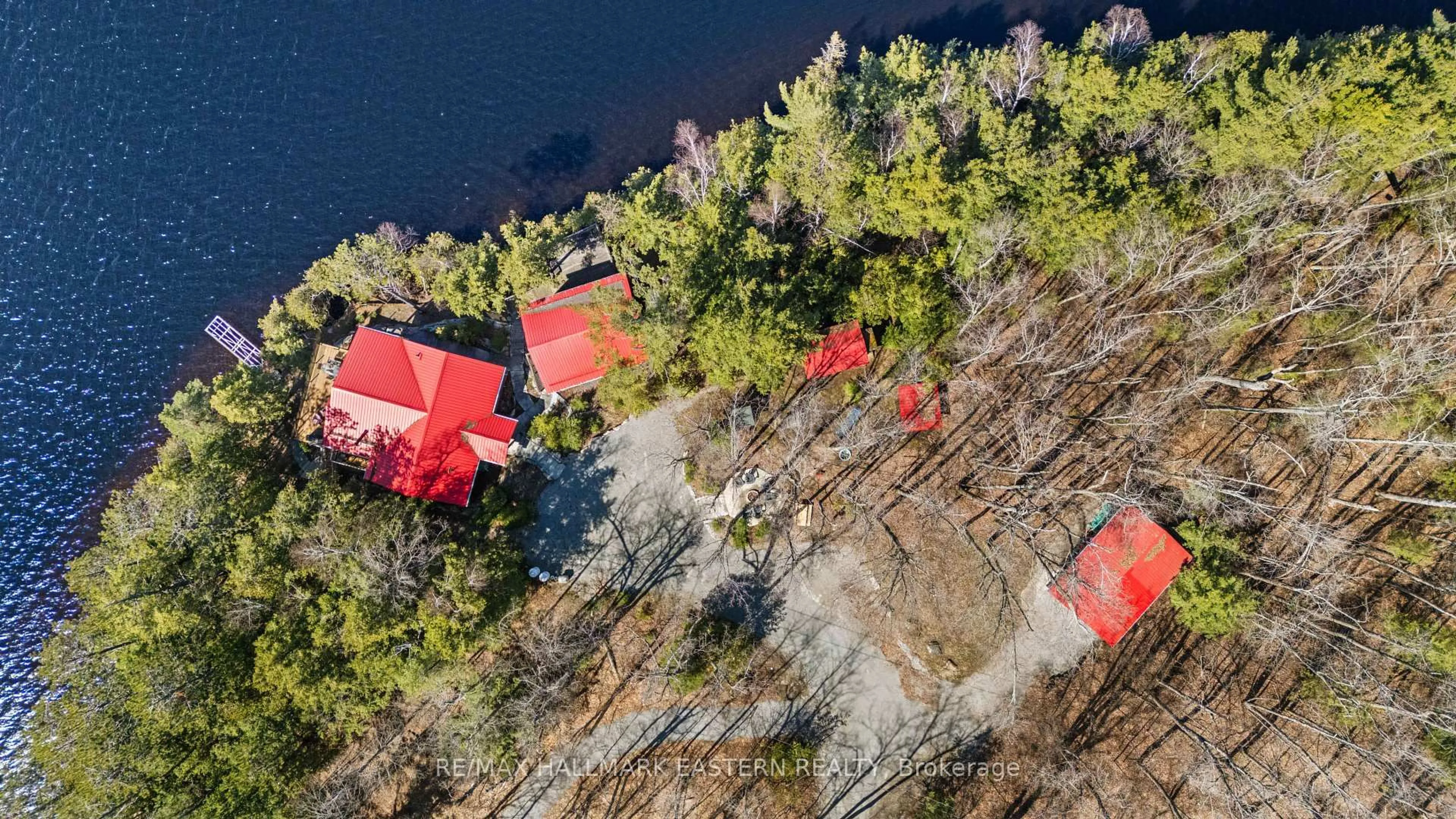 A pic from outside/outdoor area/front of a property/back of a property/a pic from drone, water/lake/river/ocean view for 66 Fire Route 209, Trent Lakes Ontario K0L 1J0