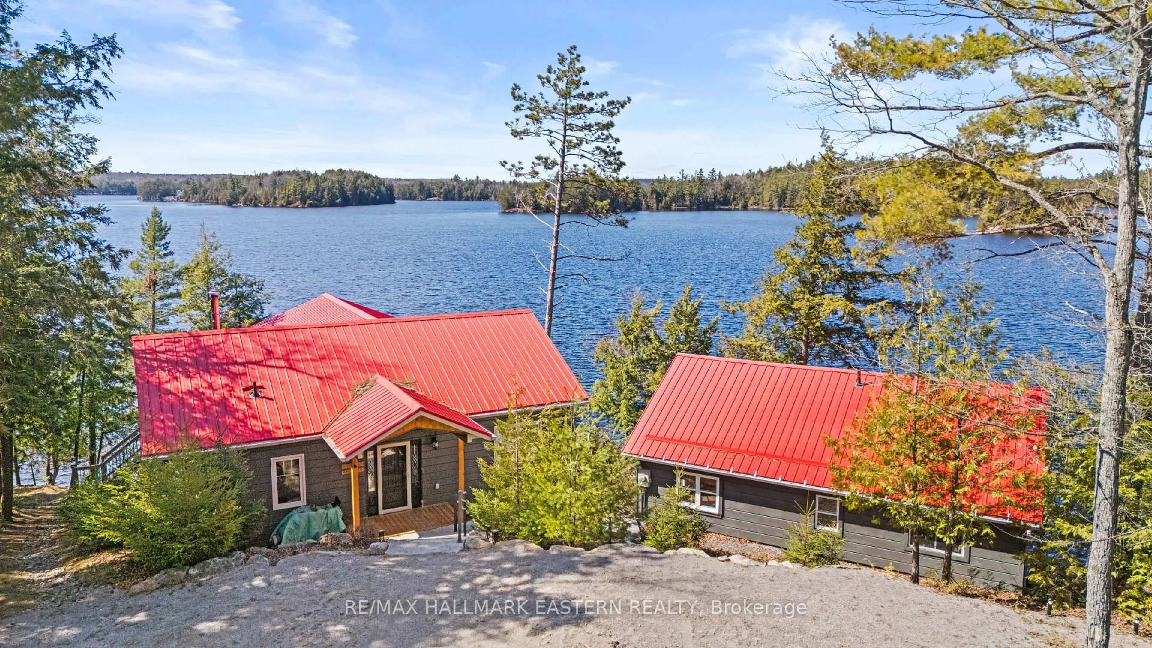 A pic from outside/outdoor area/front of a property/back of a property/a pic from drone, water/lake/river/ocean view for 66 Fire Route 209, Trent Lakes Ontario K0L 1J0