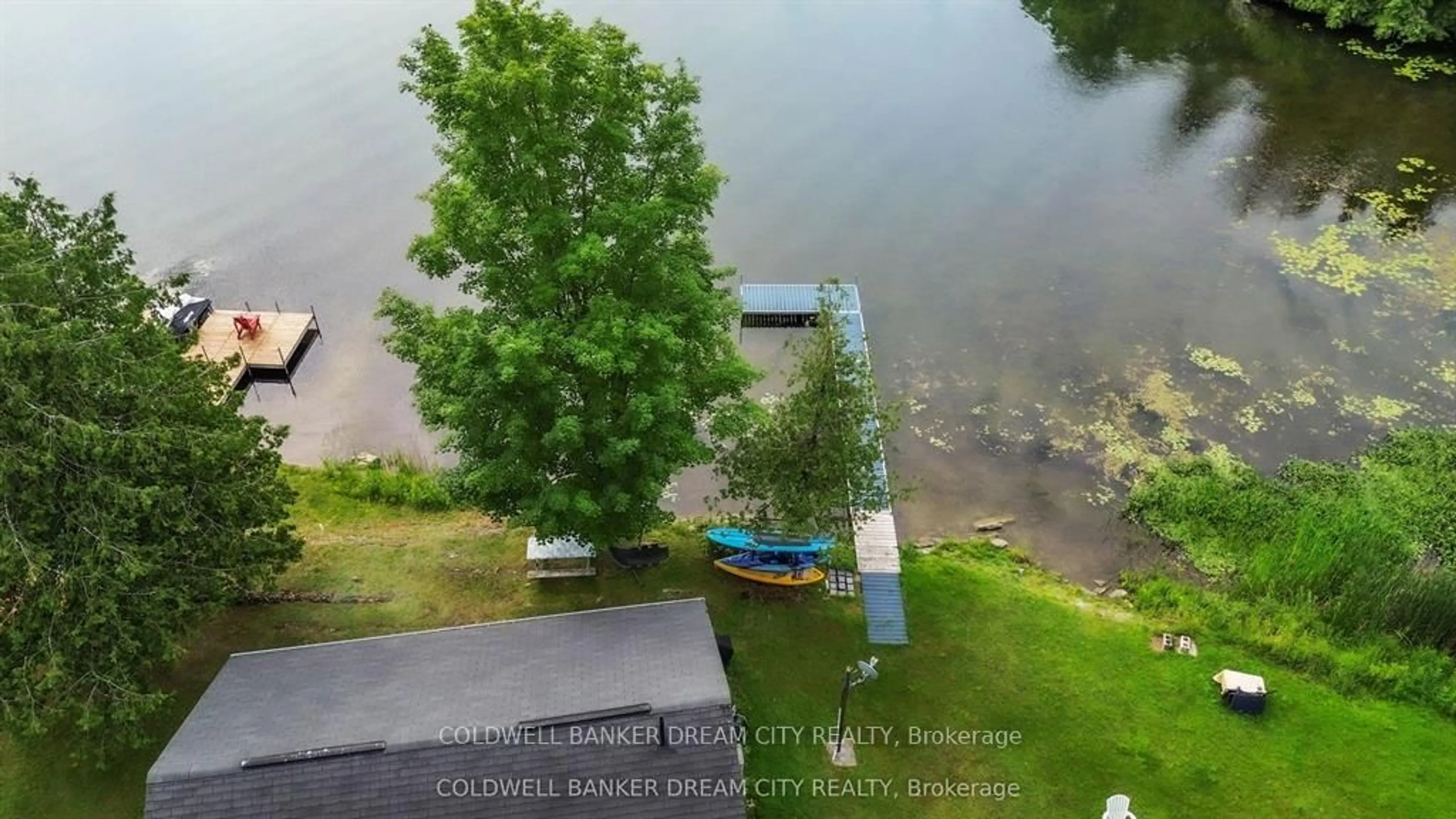 A pic from outside/outdoor area/front of a property/back of a property/a pic from drone, water/lake/river/ocean view for 1004A ALMOND Lane, Arden Ontario K0H 1B0