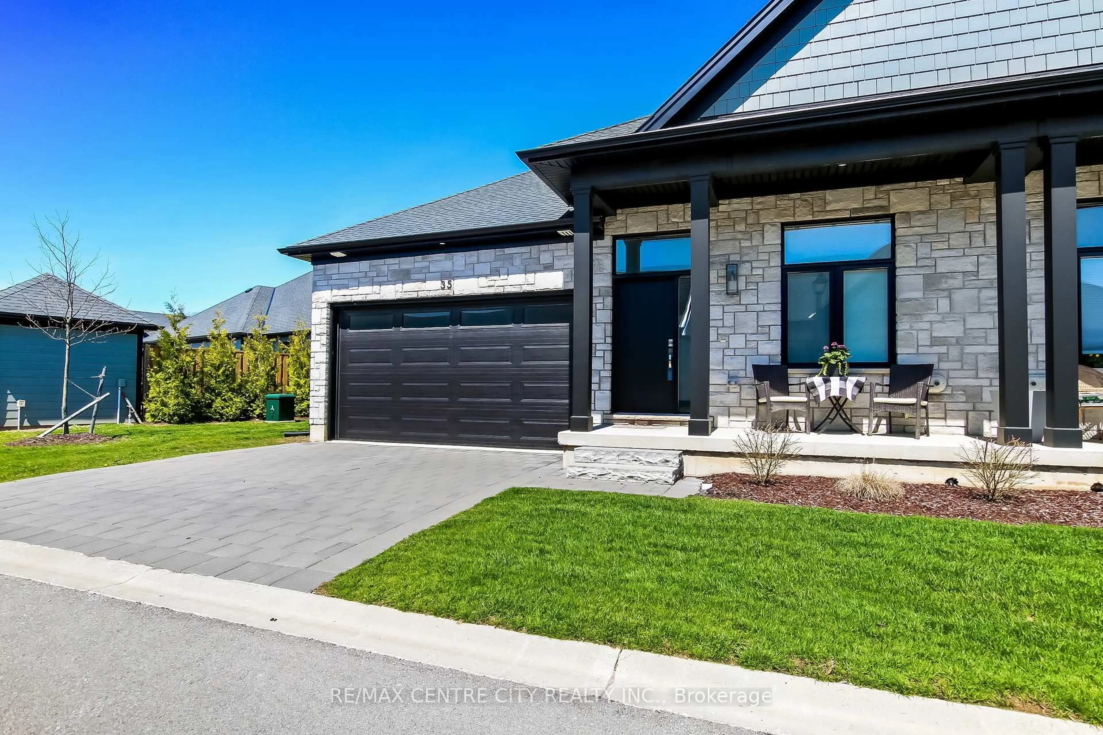 Home with brick exterior material, street for 63 Compass Tr #35, Central Elgin Ontario N5L 0B4