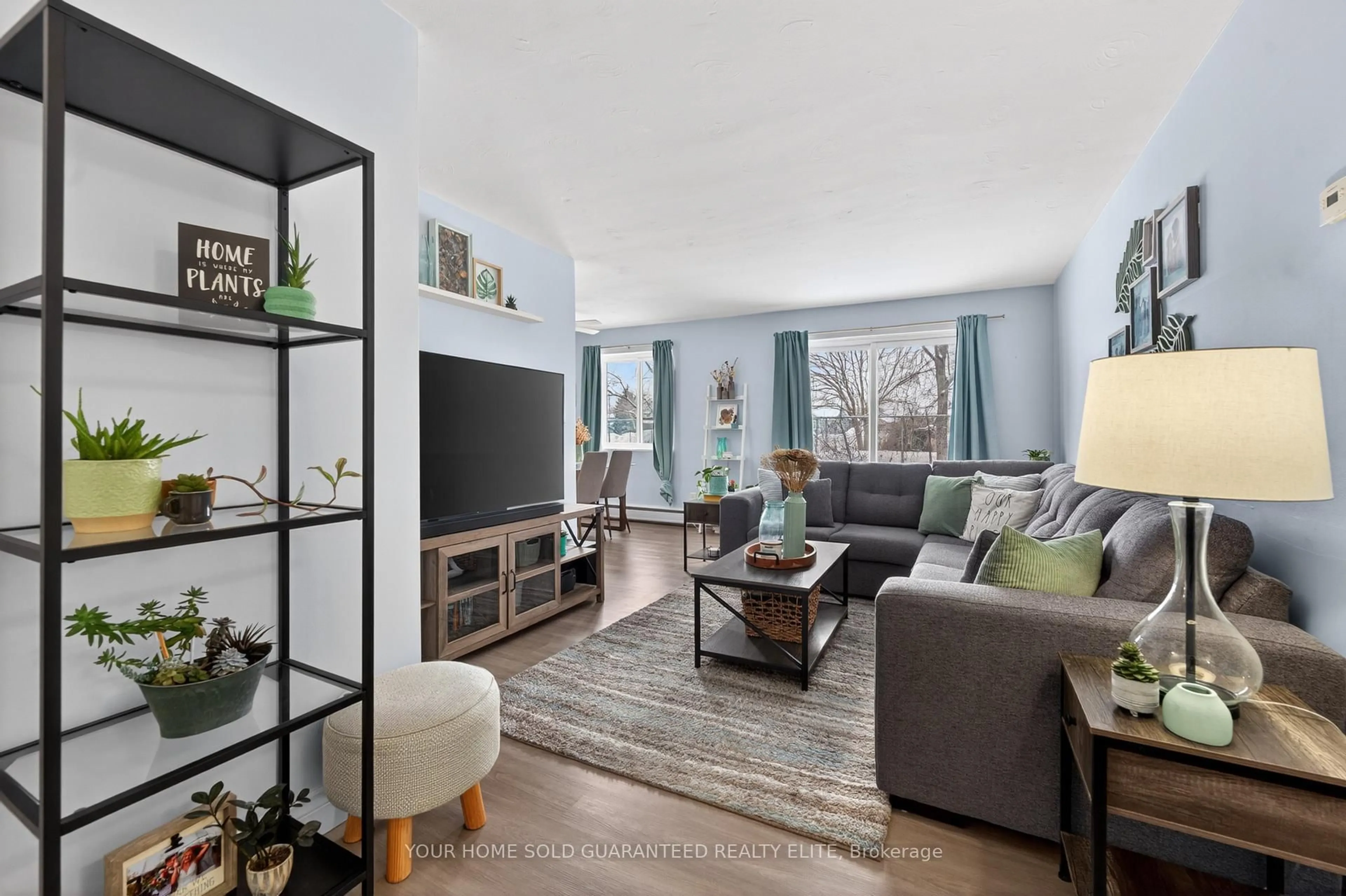 Living room with furniture, unknown for 456 Carlton St #10, St. Catharines Ontario L2M 4X1