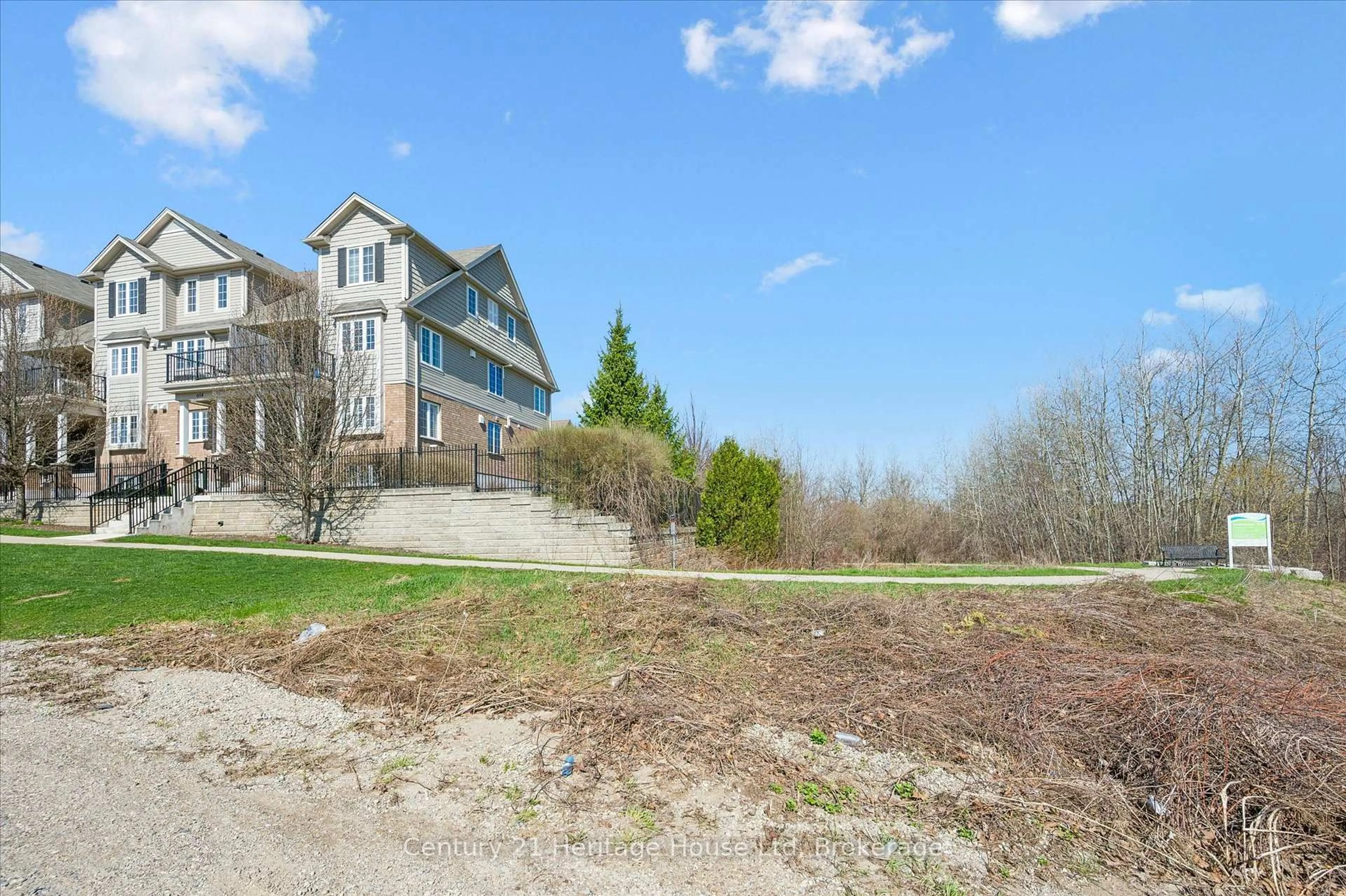 A pic from outside/outdoor area/front of a property/back of a property/a pic from drone, unknown for 656 Woodlawn Rd #B, Guelph Ontario N1E 0K4