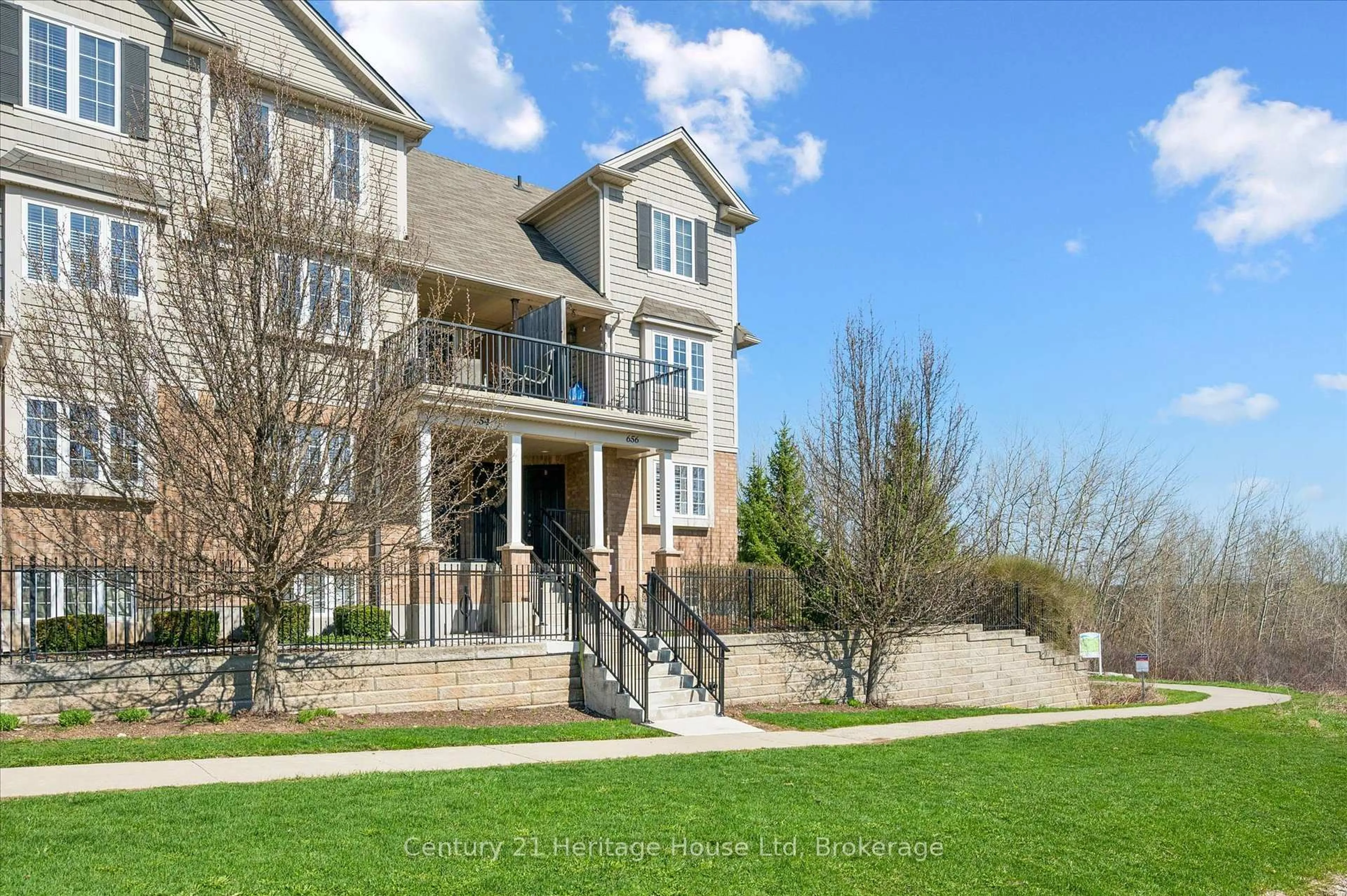 A pic from outside/outdoor area/front of a property/back of a property/a pic from drone, water/lake/river/ocean view for 656 Woodlawn Rd #B, Guelph Ontario N1E 0K4