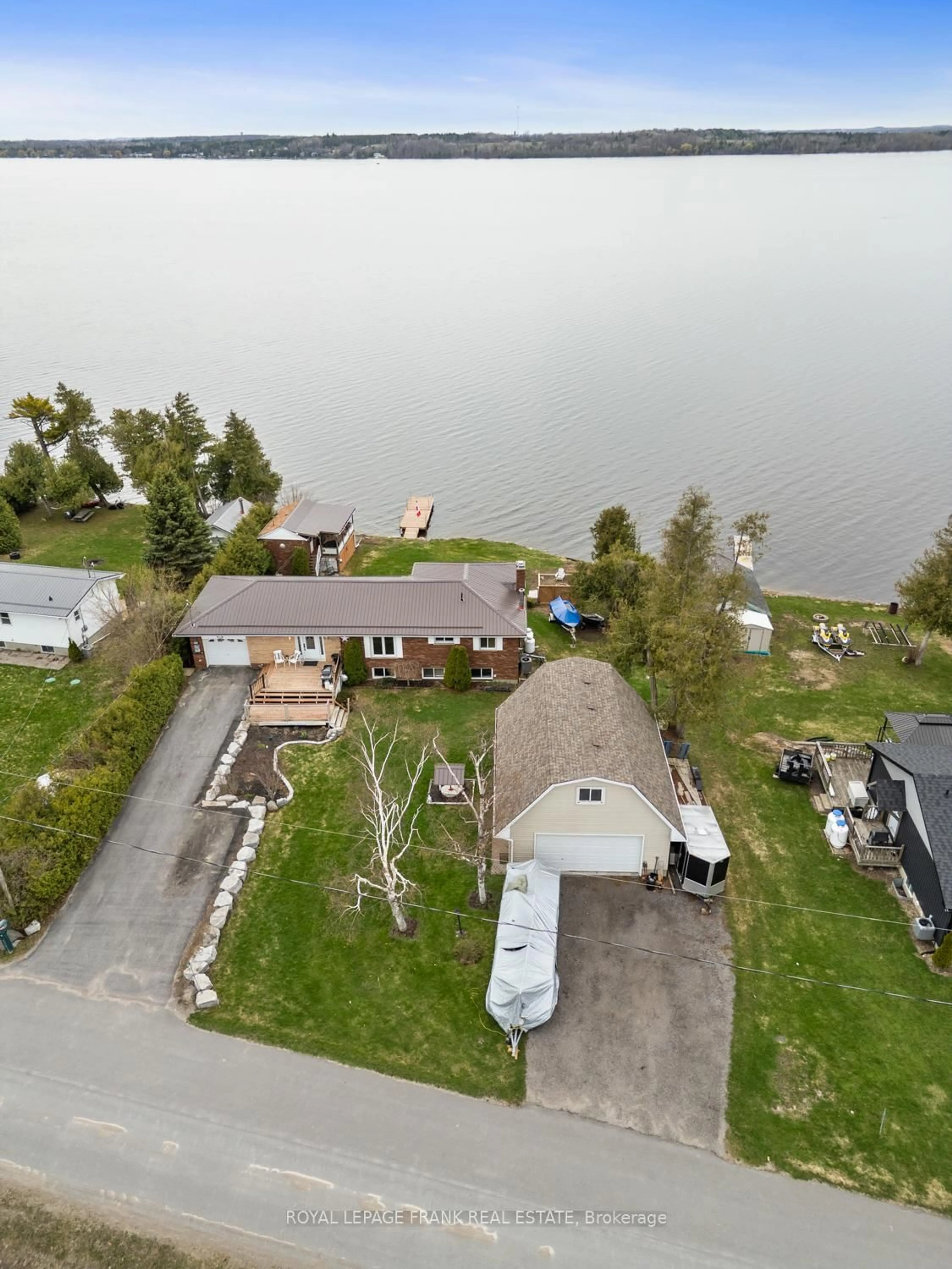 A pic from outside/outdoor area/front of a property/back of a property/a pic from drone, water/lake/river/ocean view for 106 Starr Blvd, Kawartha Lakes Ontario K0M 2C0