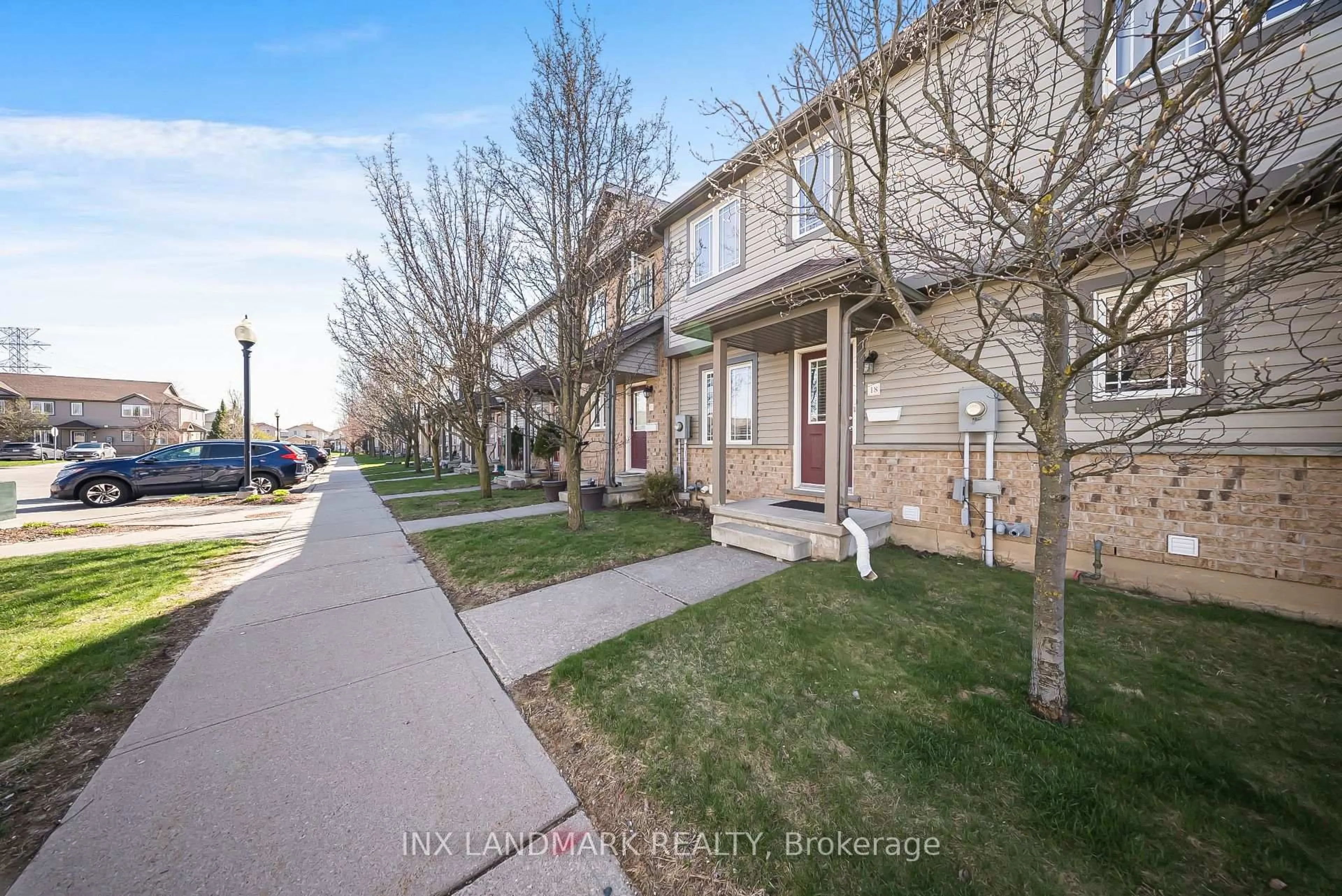 A pic from outside/outdoor area/front of a property/back of a property/a pic from drone, street for 535 Windflower Cres #18, Kitchener Ontario N2E 4L7