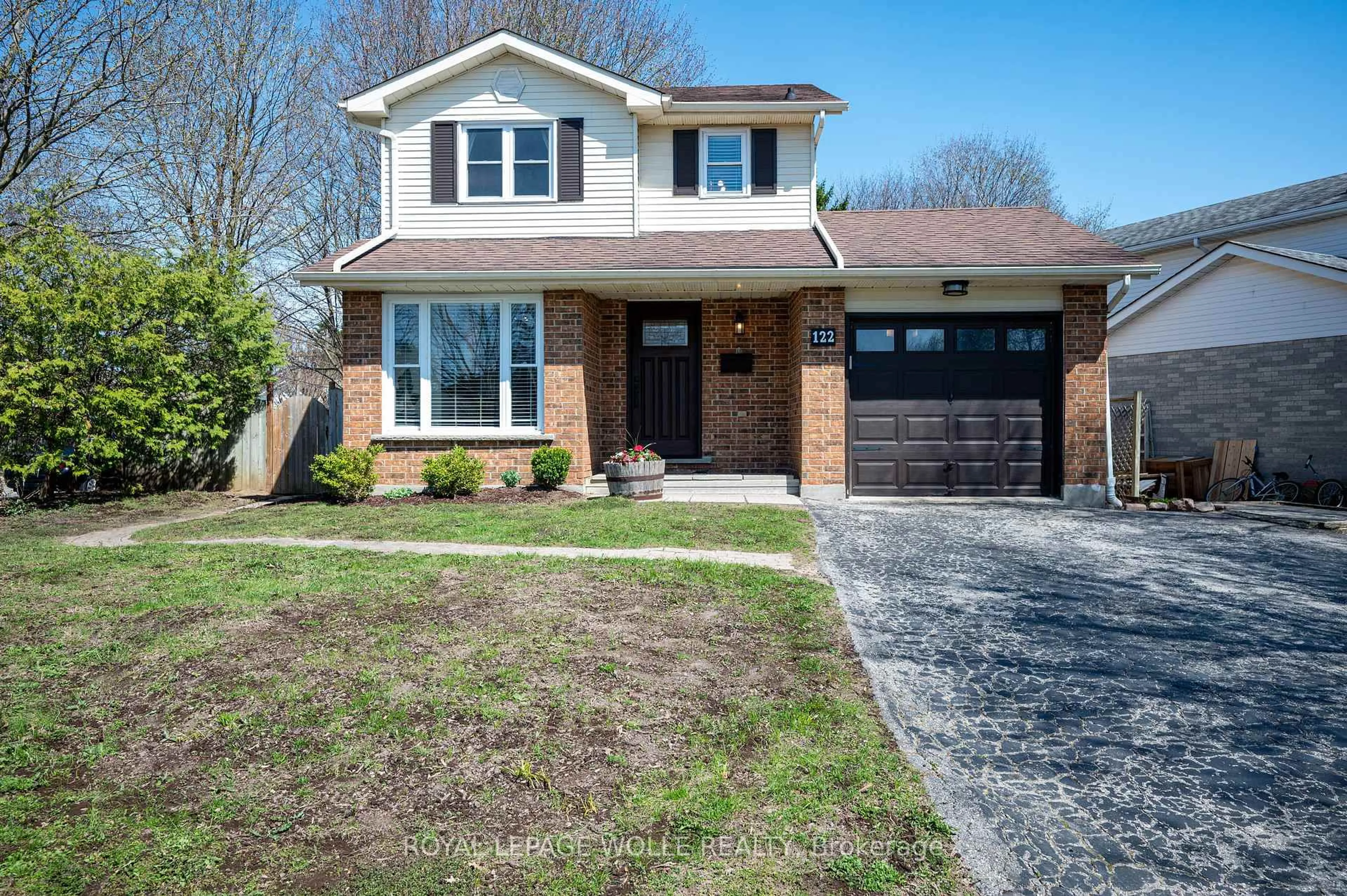 Home with brick exterior material, street for 122 Foxhunt Rd, Waterloo Ontario N2K 3N1