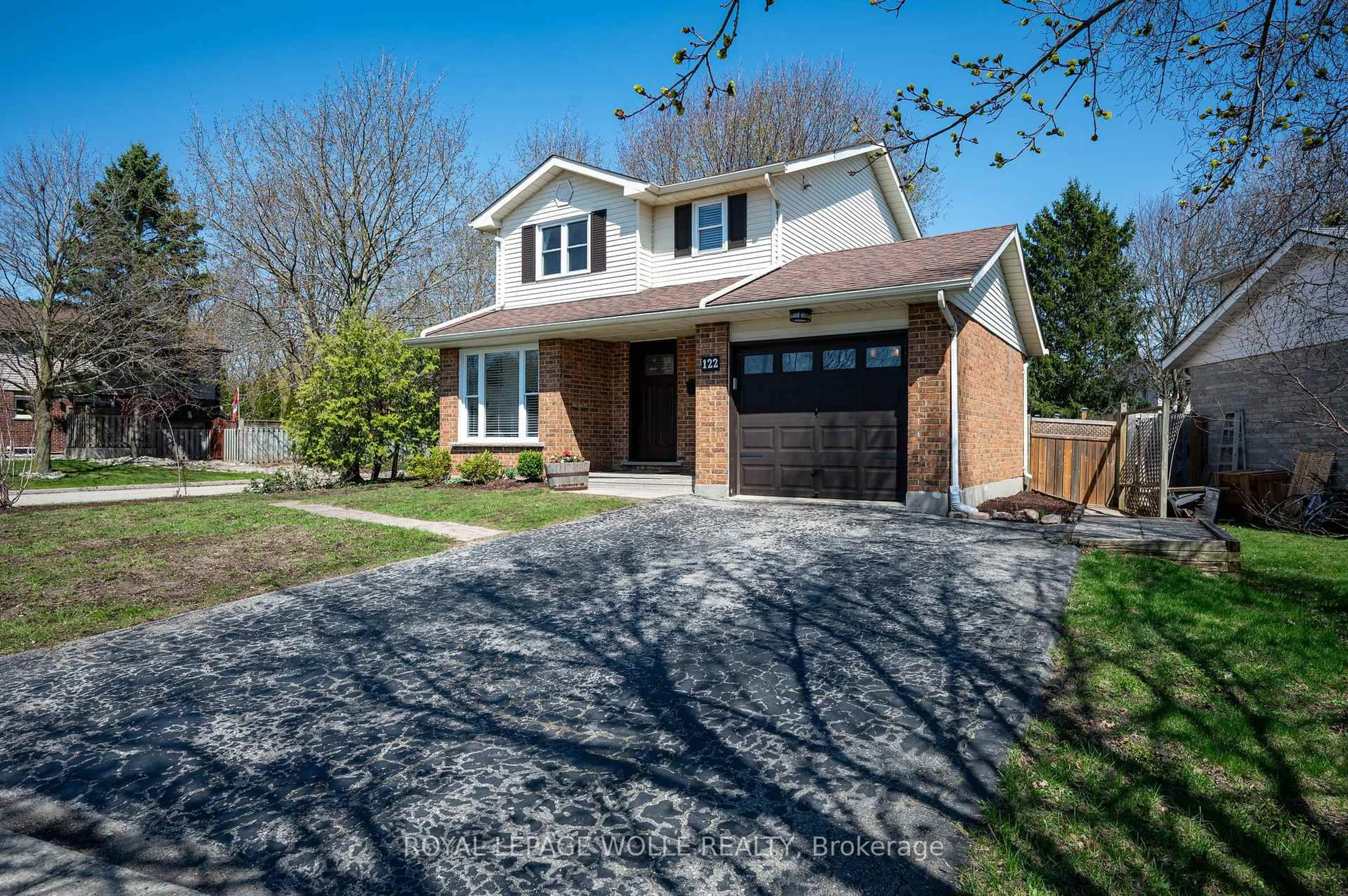 Home with brick exterior material, street for 122 Foxhunt Rd, Waterloo Ontario N2K 3N1