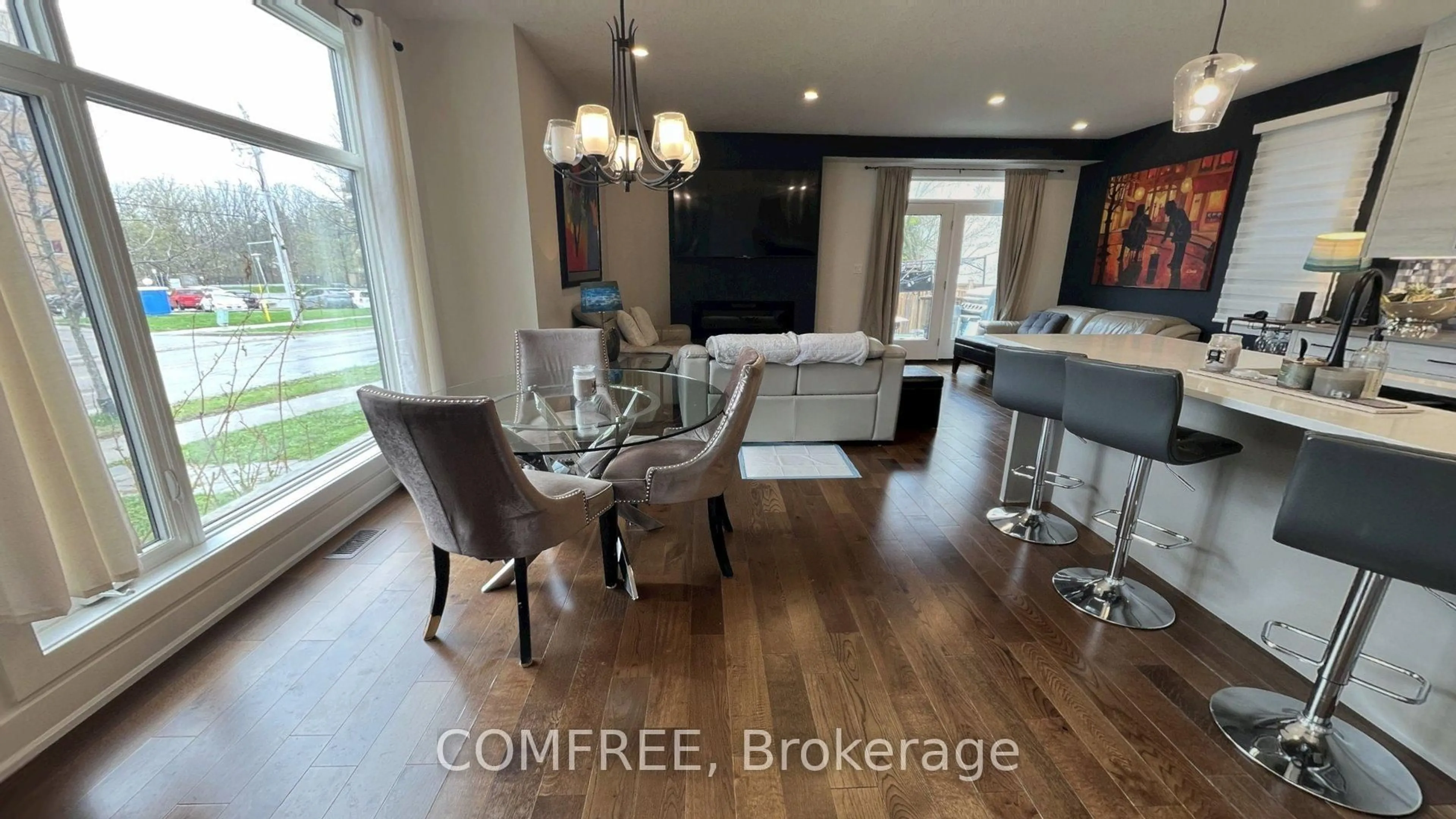 Open concept kitchen, wood/laminate floor for 498 Phyllis St, London South Ontario N6G 0K5