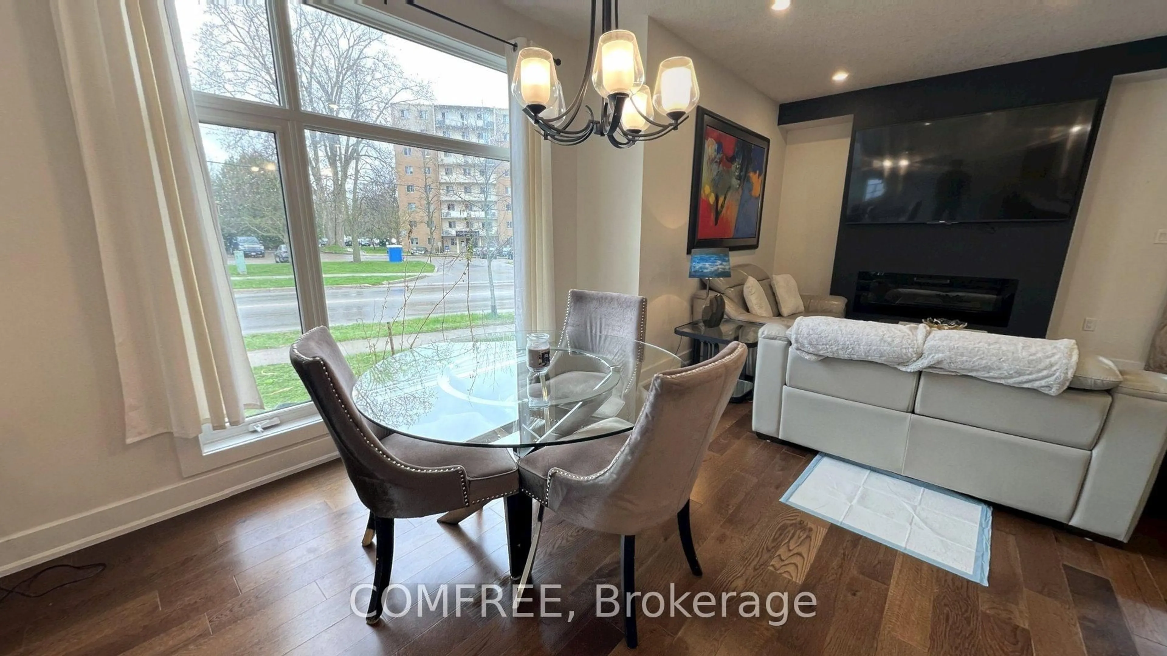 Dining room, wood/laminate floor for 498 Phyllis St, London South Ontario N6G 0K5