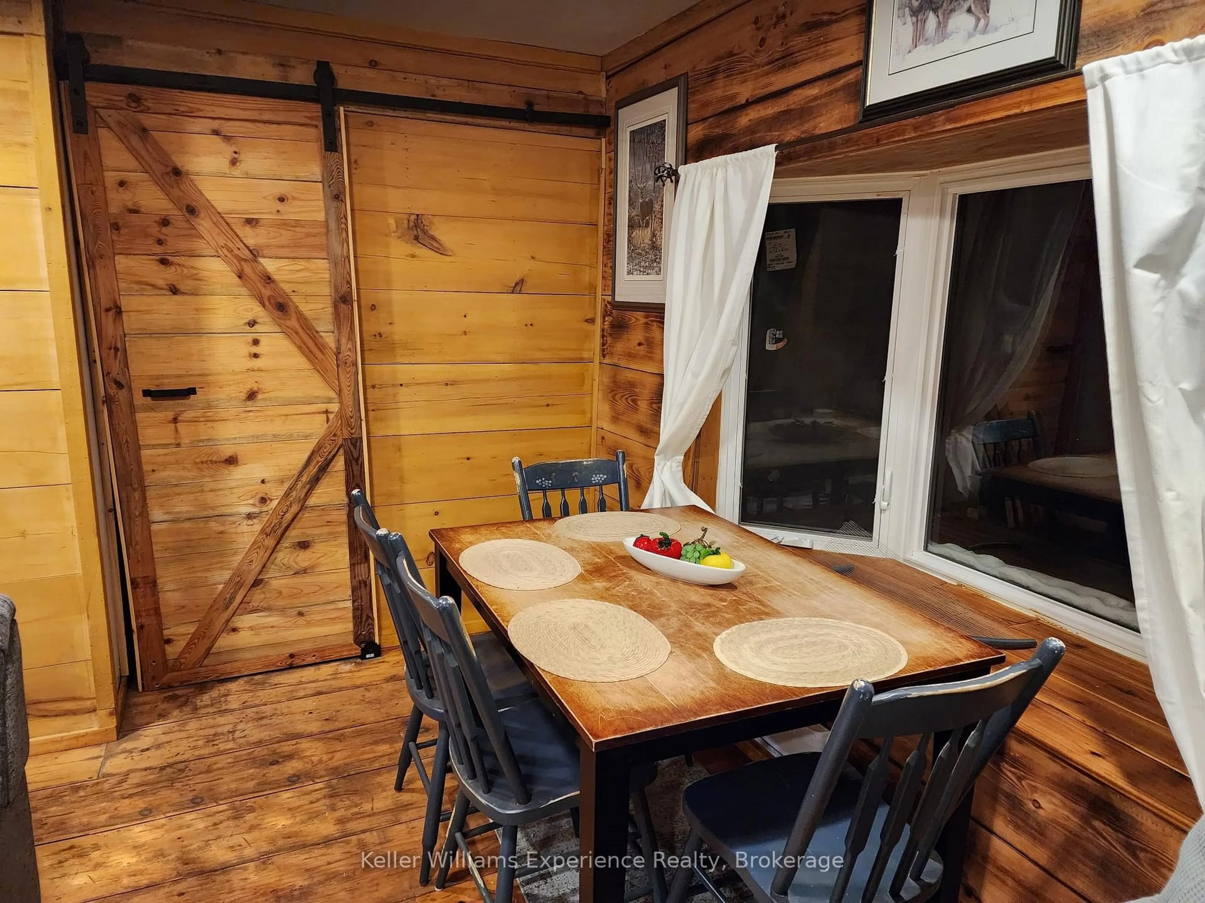 Dining room, wood/laminate floor for 76 Machar River Rd, Machar Ontario P0A 1X0