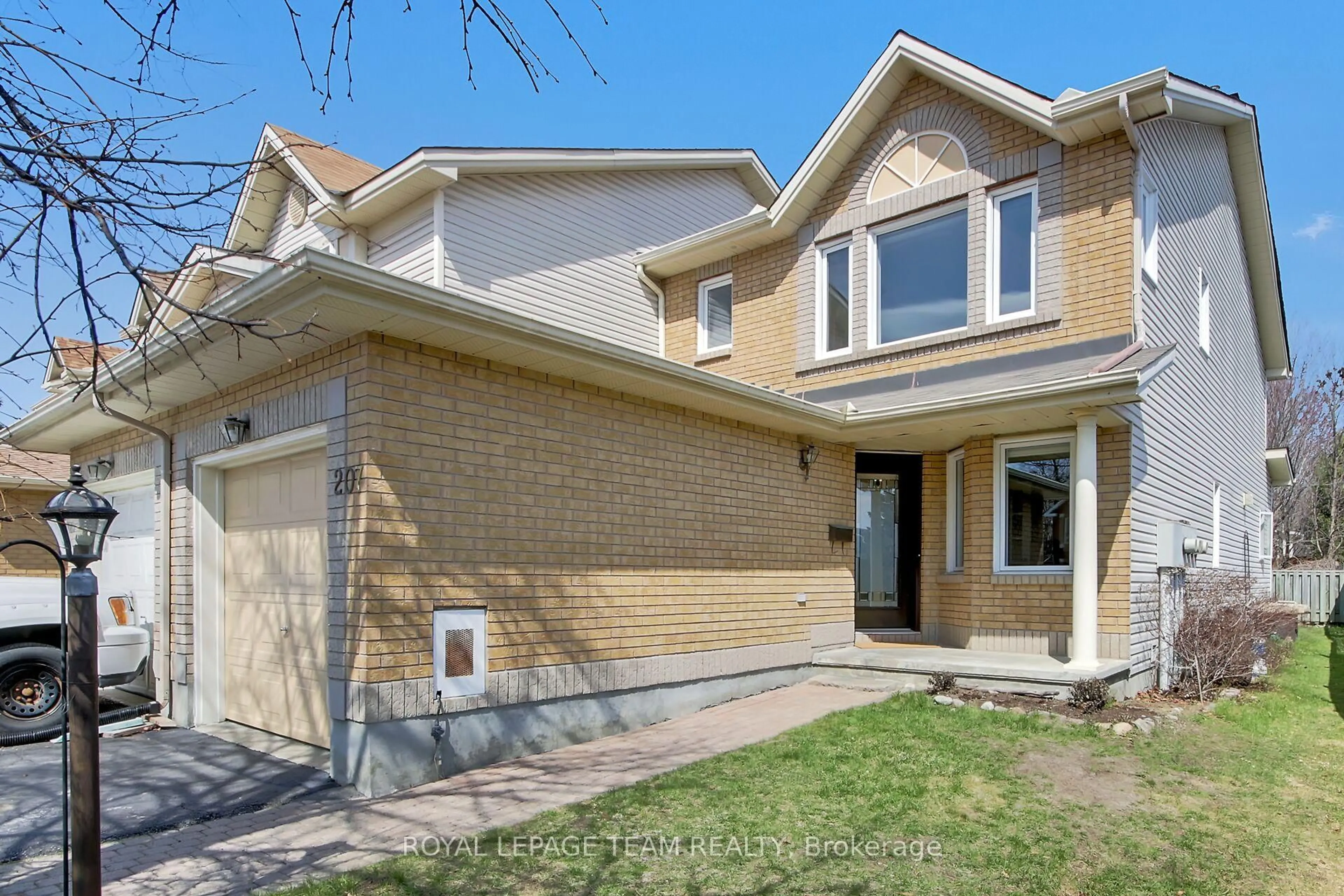 Home with brick exterior material, street for 207 Beatrice Dr, Ottawa Ontario K2J 4P1