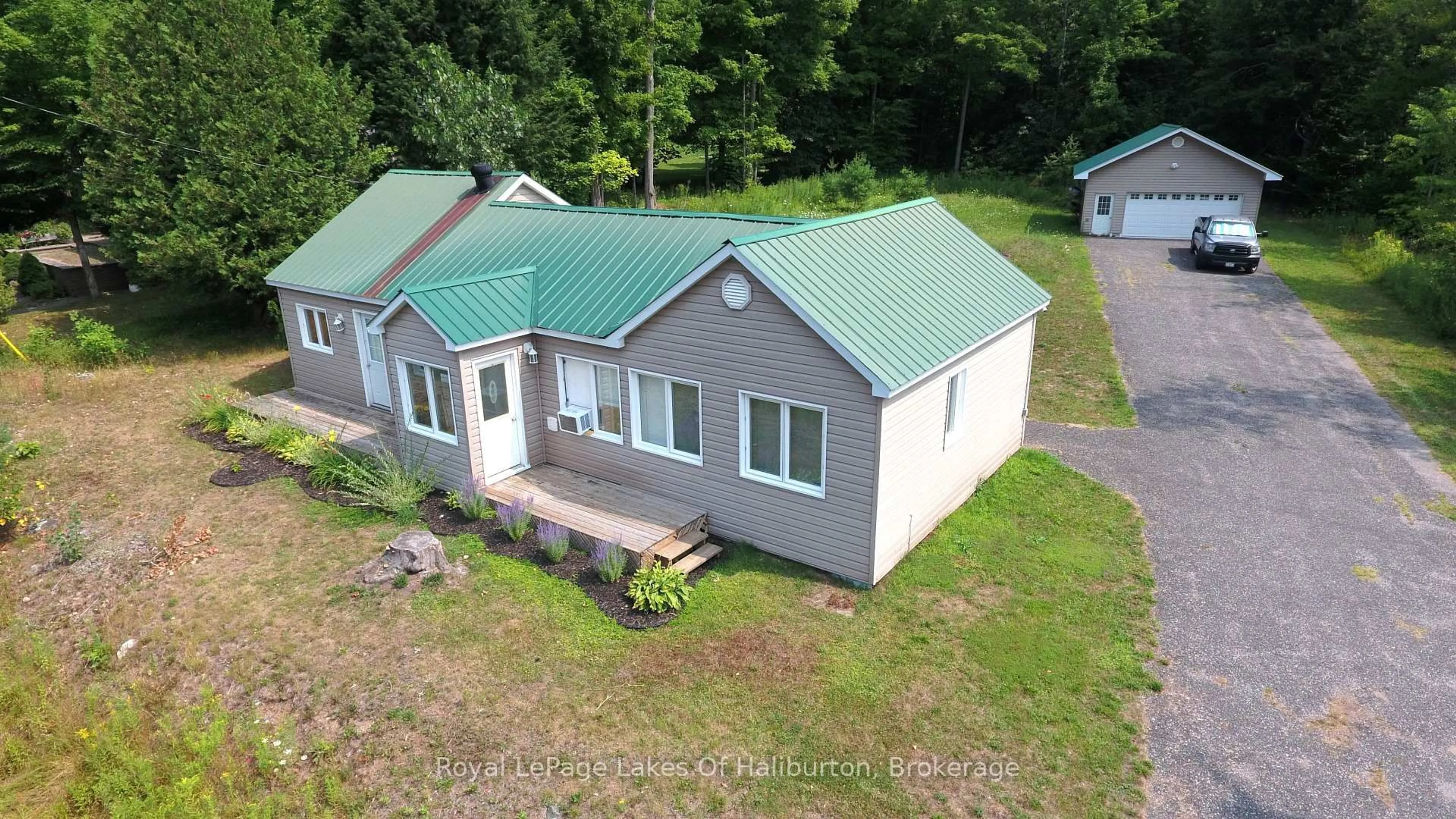 A pic from outside/outdoor area/front of a property/back of a property/a pic from drone, building for 16426 35 Highway, Algonquin Highlands Ontario K0M 1S0