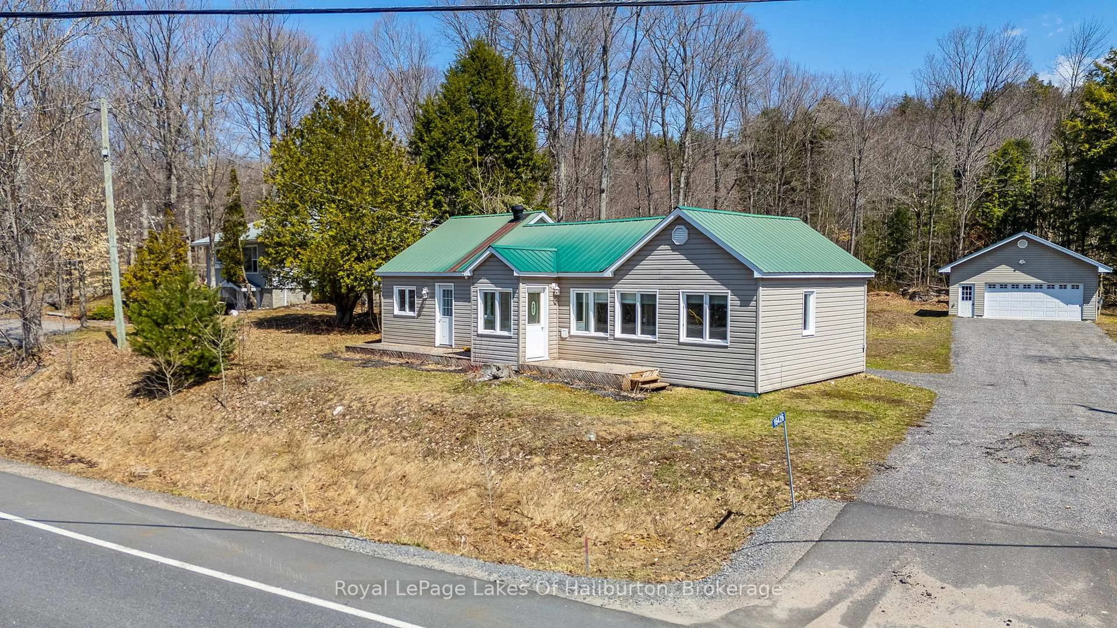 A pic from outside/outdoor area/front of a property/back of a property/a pic from drone, street for 16426 35 Highway, Algonquin Highlands Ontario K0M 1S0