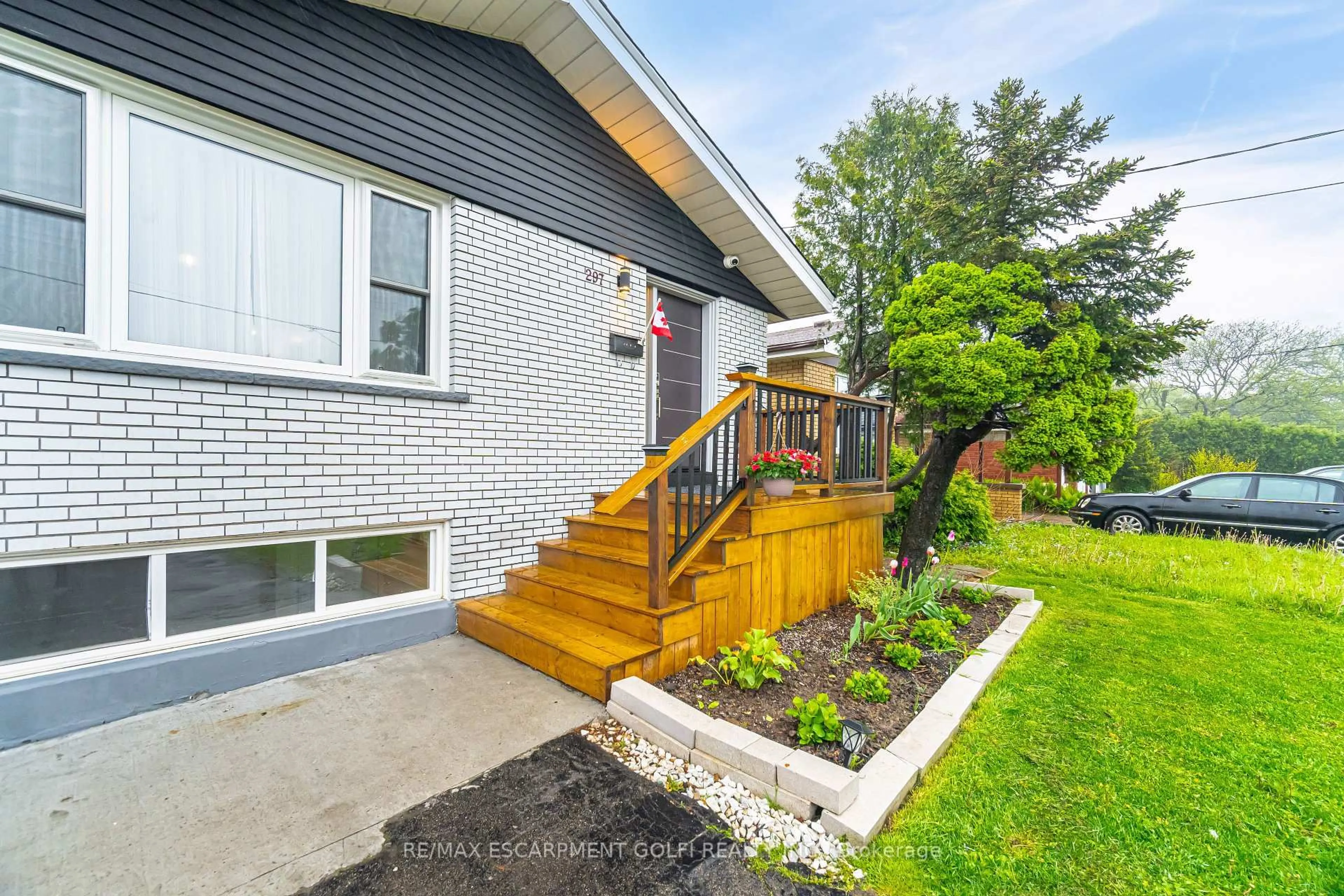 Home with brick exterior material, street for 297 Mohawk Rd, Hamilton Ontario L9C 1W2