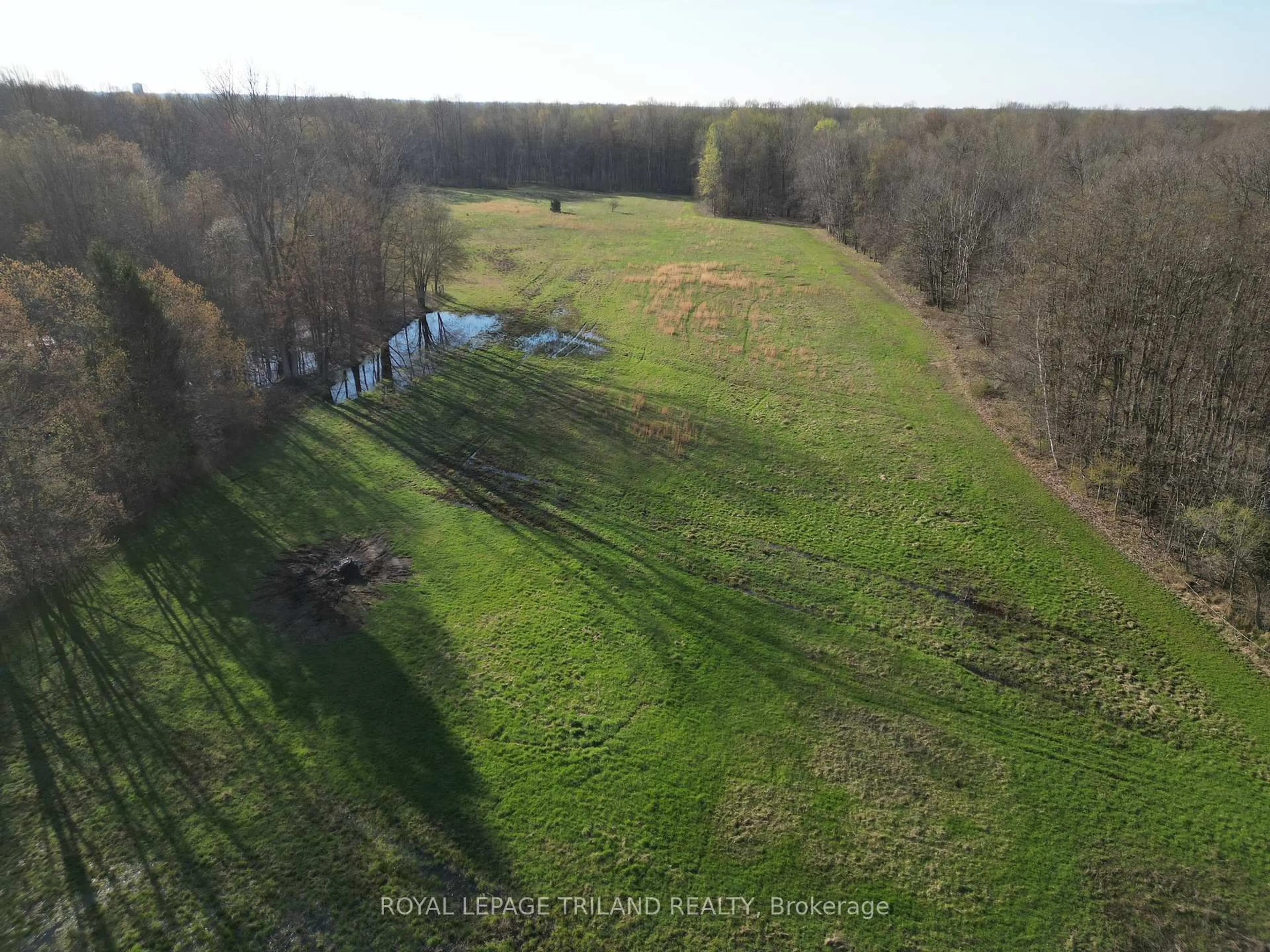 A pic from outside/outdoor area/front of a property/back of a property/a pic from drone, water/lake/river/ocean view for 24909 Queens Line, West Elgin Ontario N0L 2P0