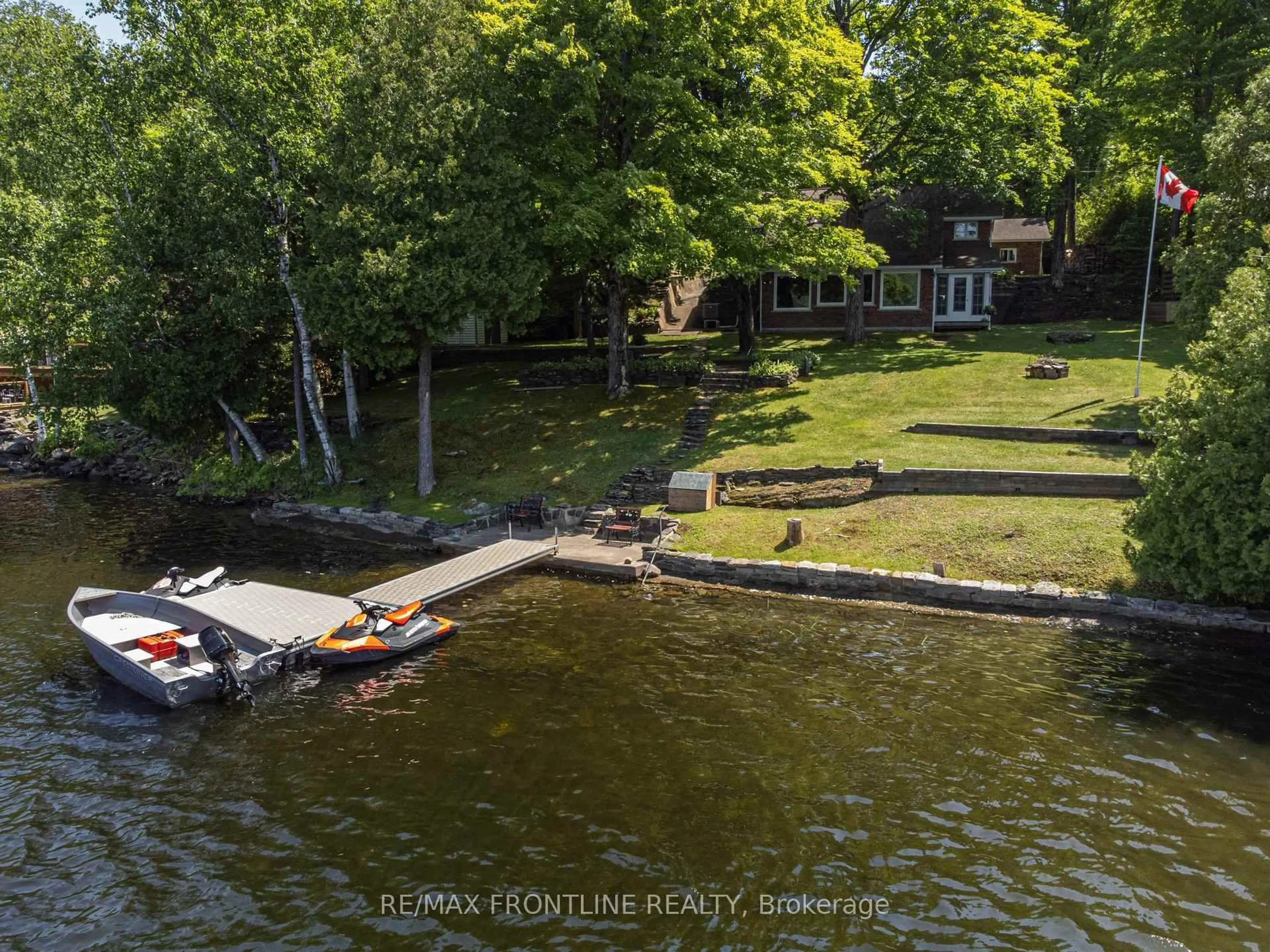 A pic from outside/outdoor area/front of a property/back of a property/a pic from drone, water/lake/river/ocean view for 1047 Country Lane, Frontenac Ontario K0H 2P2