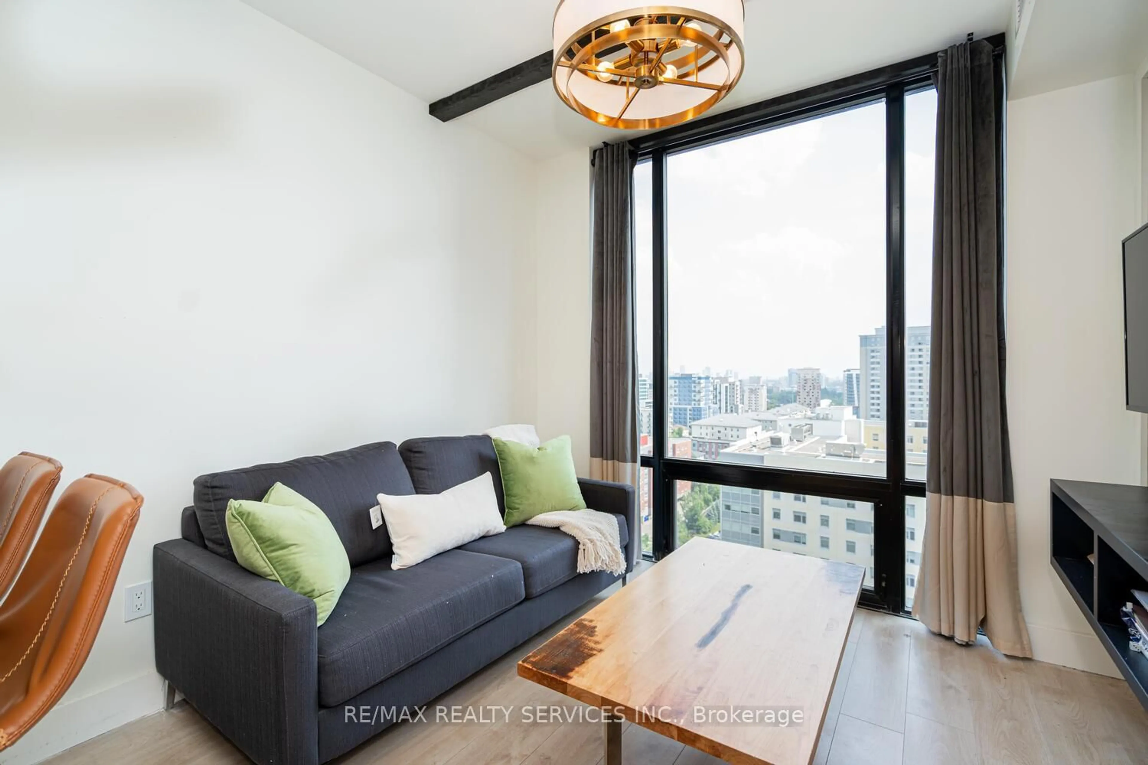 Living room with furniture, wood/laminate floor for 145 Columbia St #1736, Waterloo Ontario N2L 0K7