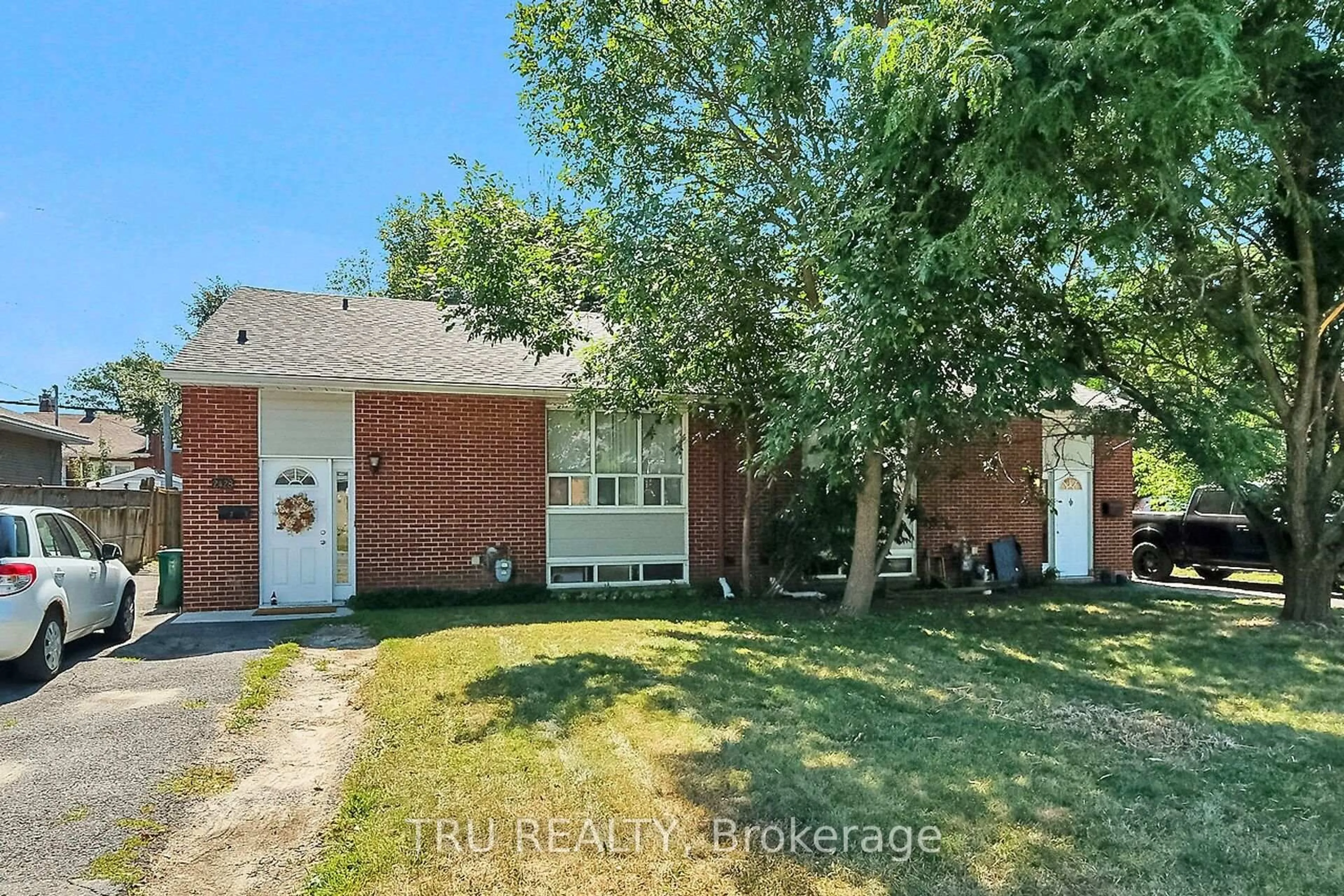 Home with brick exterior material, street for 2428-2430 Iris St, Ottawa Ontario K2C 2C6