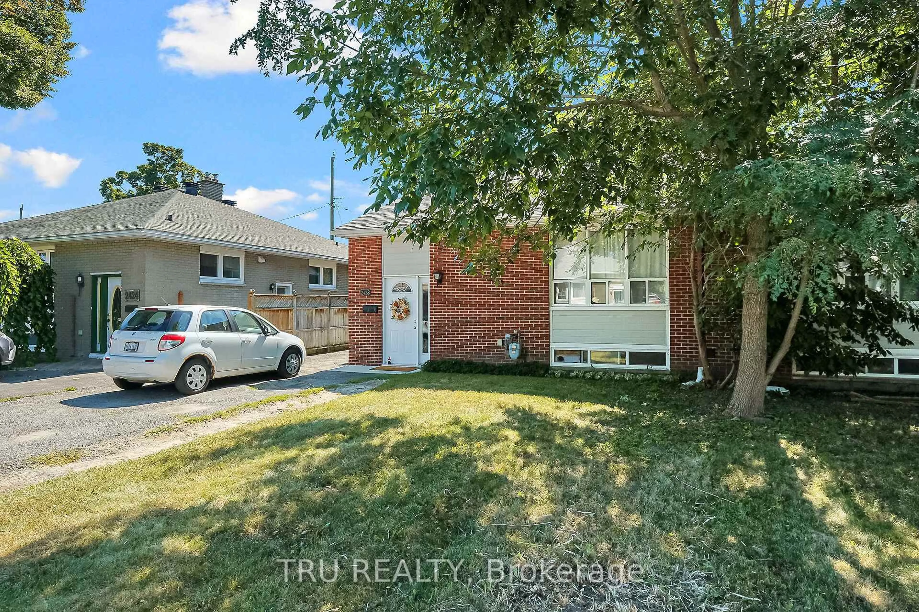 Home with brick exterior material, street for 2428-2430 Iris St, Ottawa Ontario K2C 2C6
