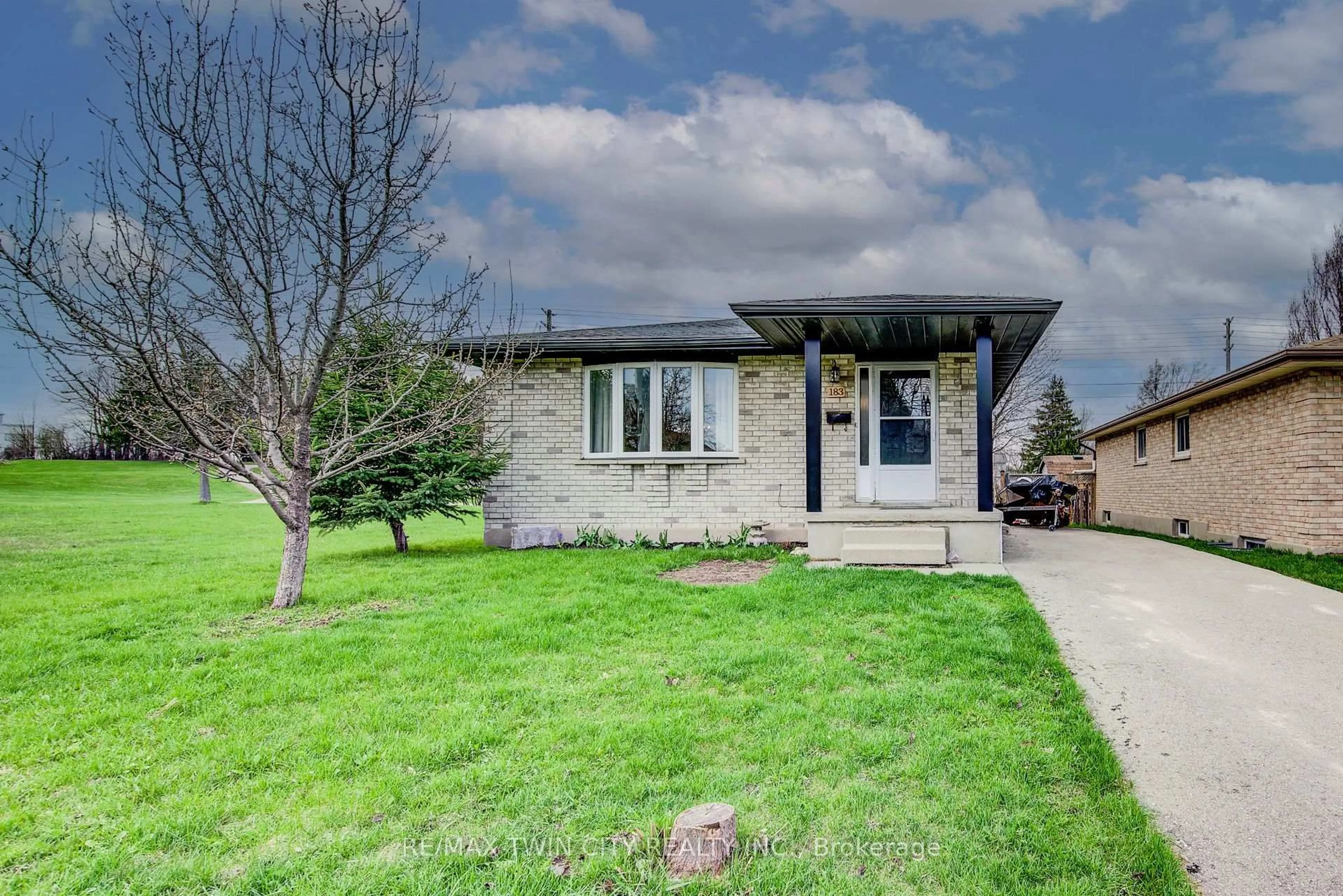 Home with brick exterior material, street for 183 Dinison Cres, Kitchener Ontario N2E 2S6