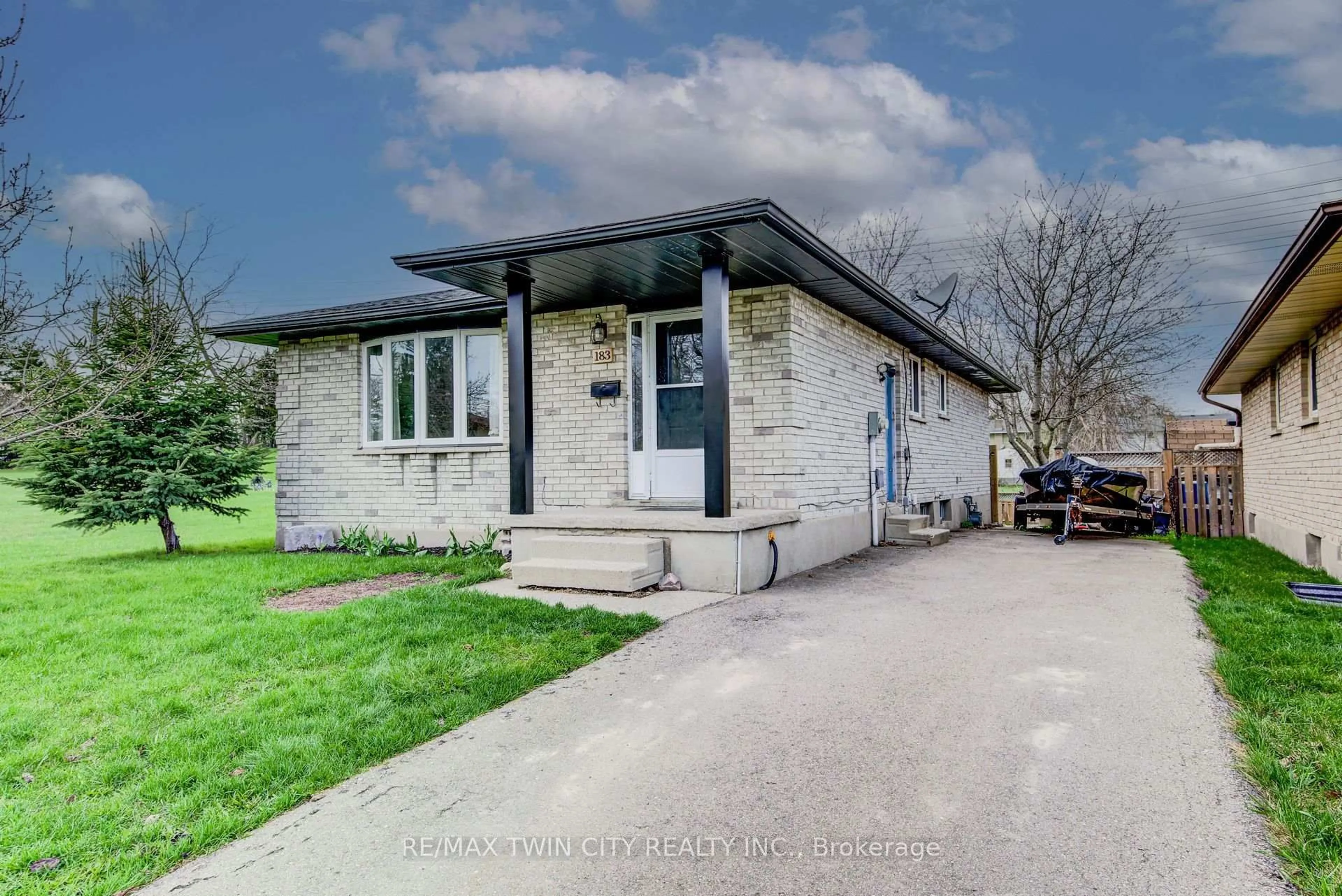 Home with brick exterior material, street for 183 Dinison Cres, Kitchener Ontario N2E 2S6