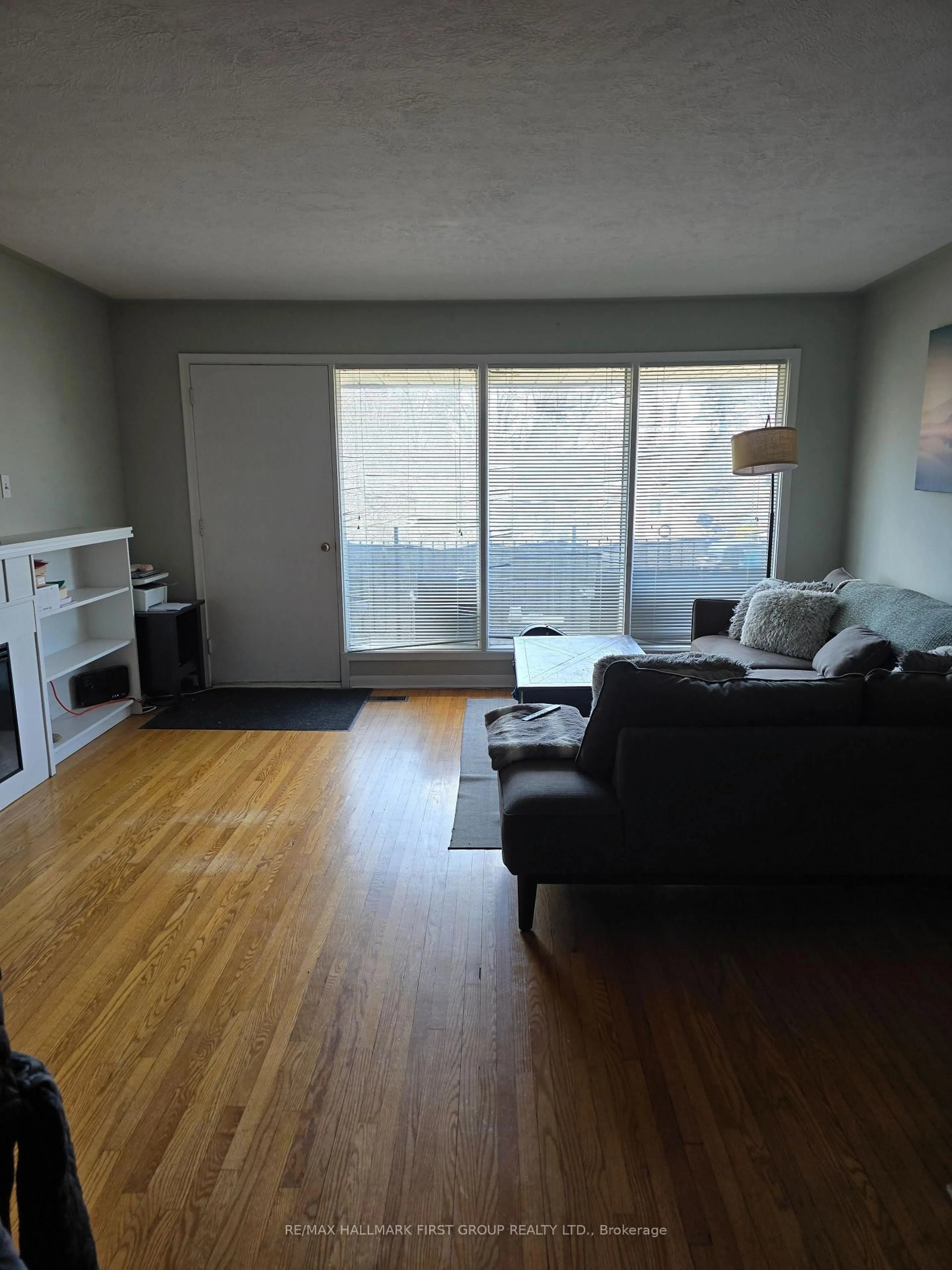 Living room with furniture, wood/laminate floor for 730 Chemong Rd, Peterborough Ontario K9H 5Y9