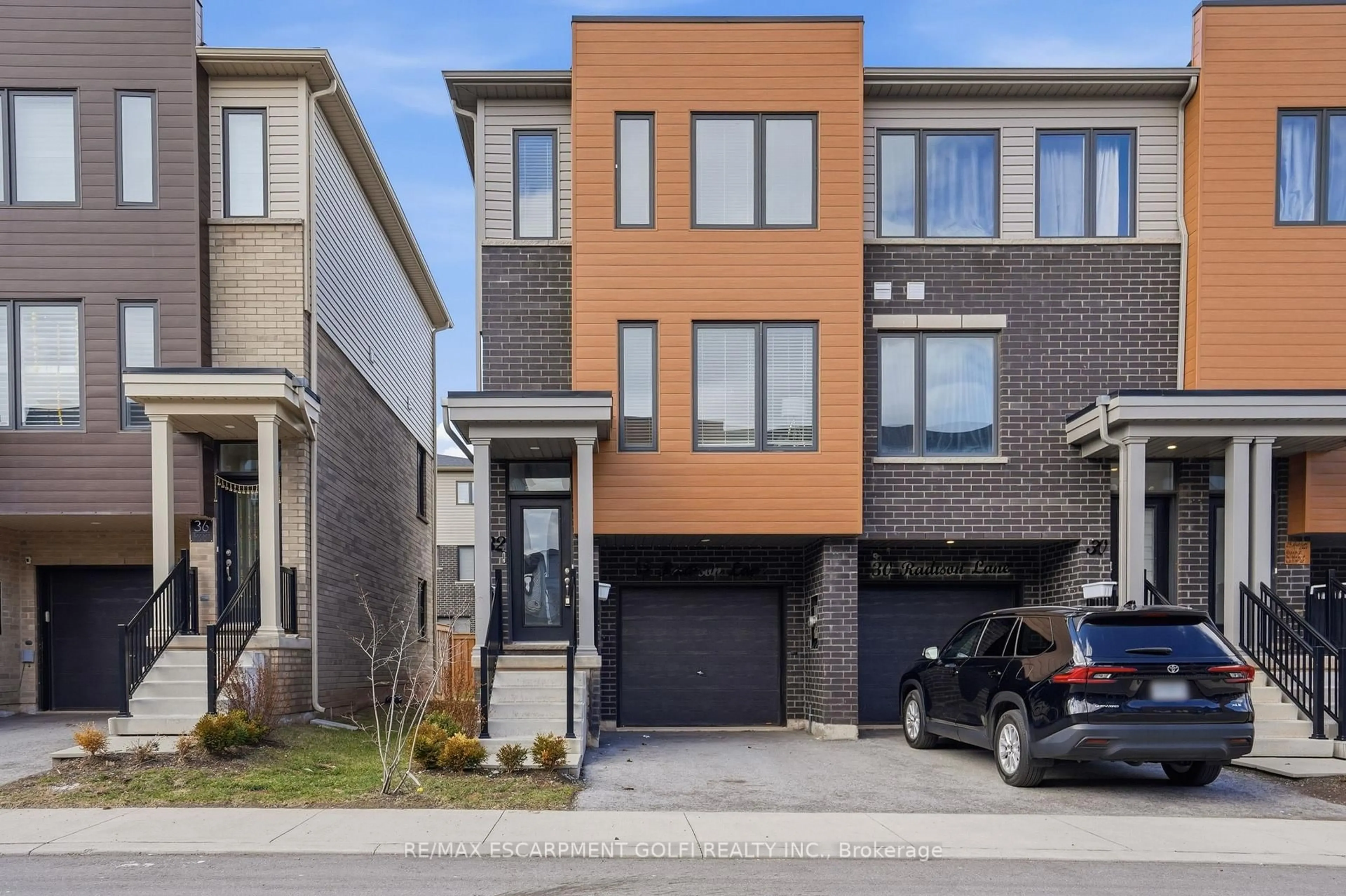 Home with brick exterior material, street for 32 Radison Lane, Hamilton Ontario L7R 4E2