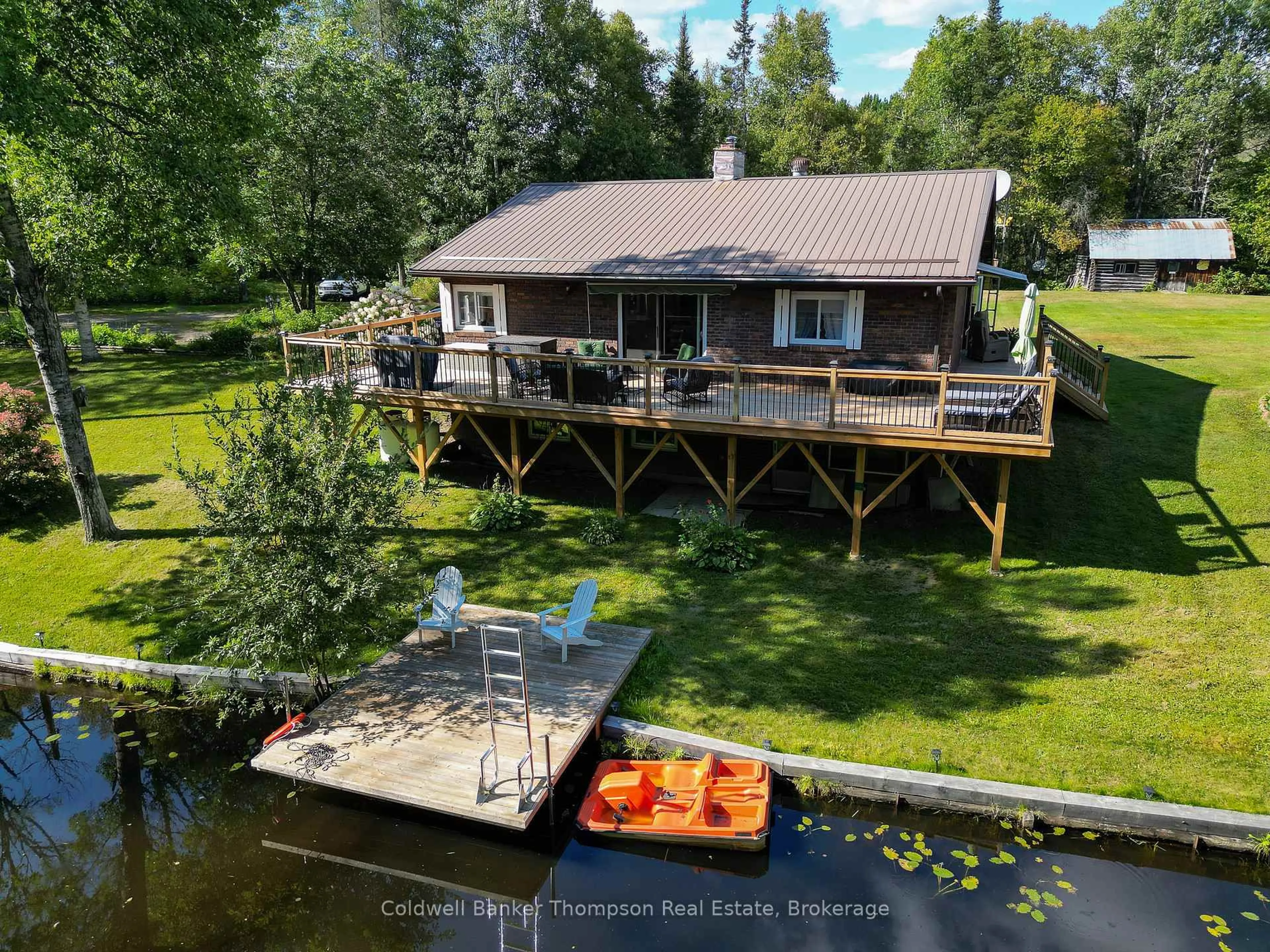 A pic from outside/outdoor area/front of a property/back of a property/a pic from drone, water/lake/river/ocean view for 15 Municipal Rd, Machar Ontario P0A 1X0