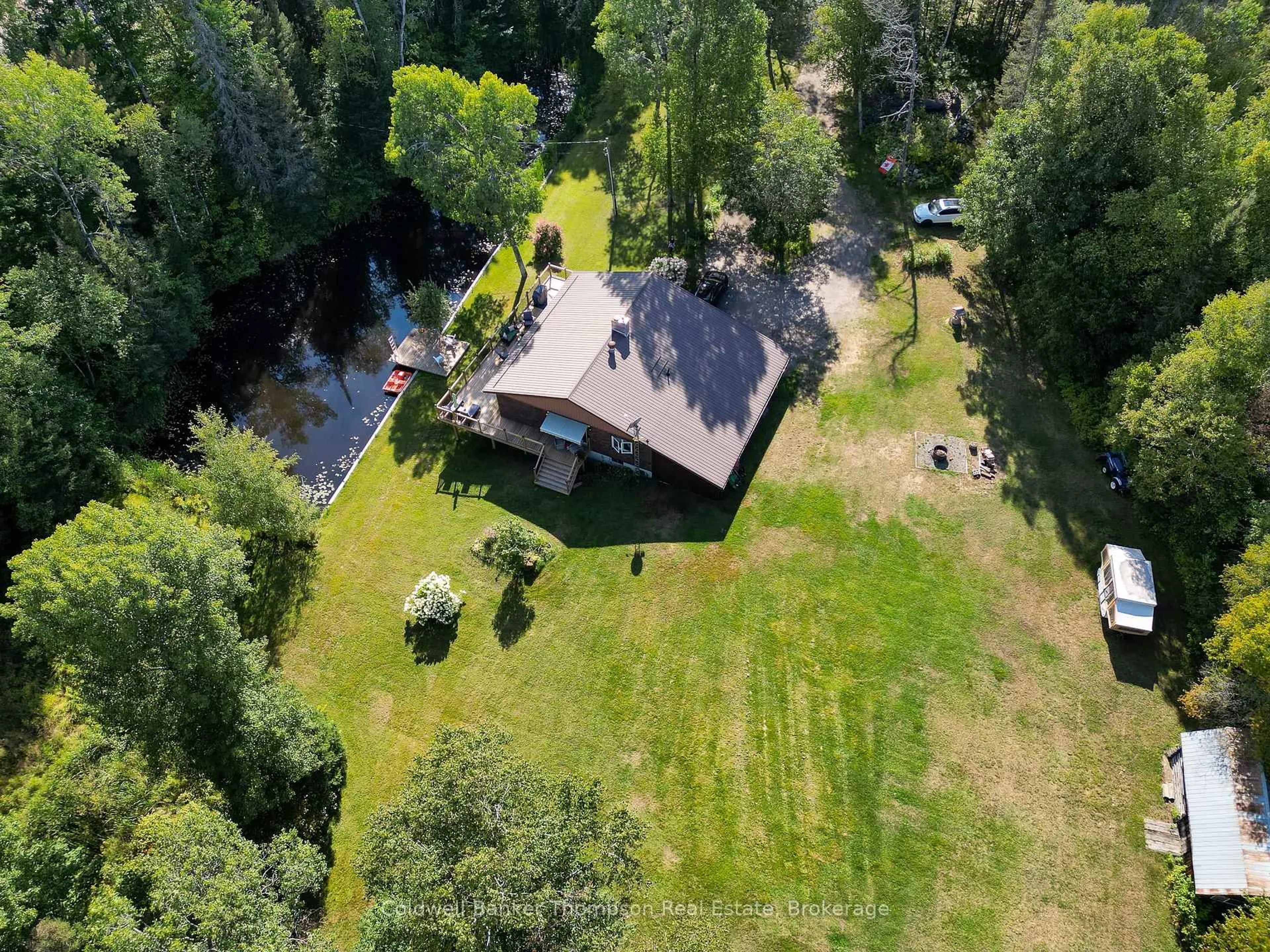 A pic from outside/outdoor area/front of a property/back of a property/a pic from drone, forest/trees view for 15 Municipal Rd, Machar Ontario P0A 1X0