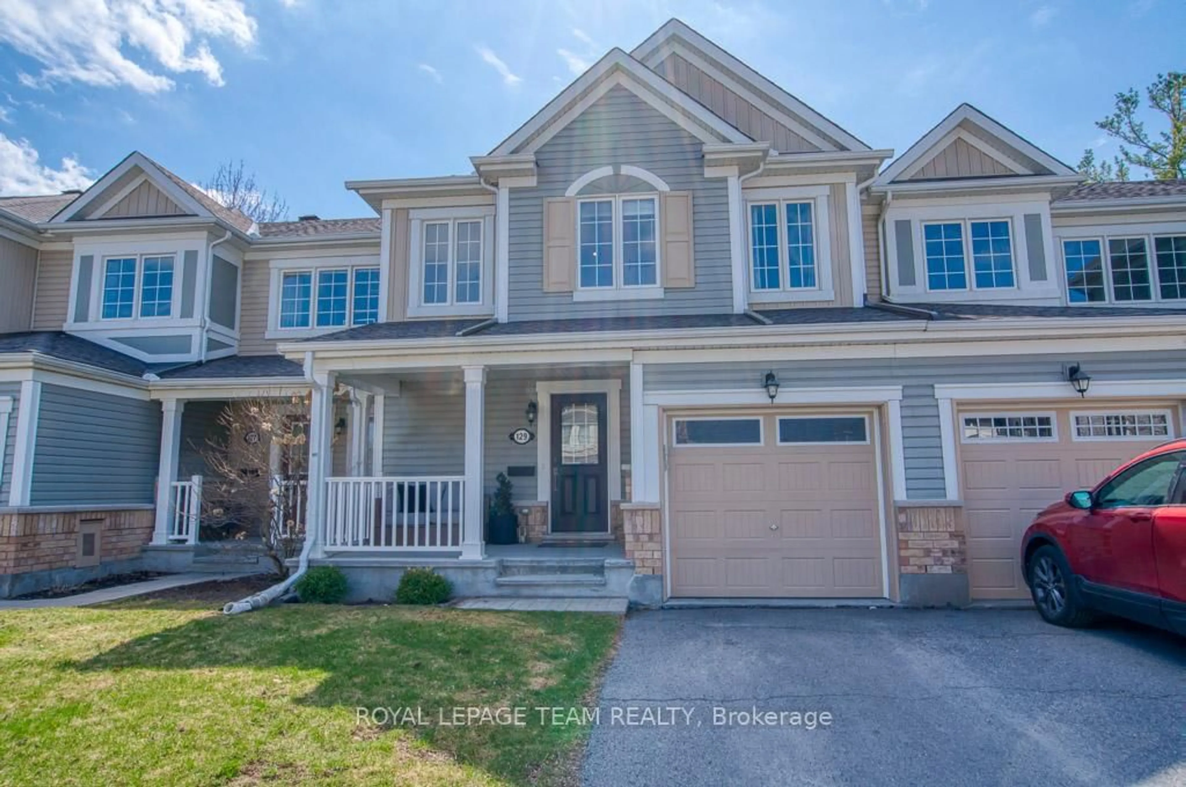 Home with vinyl exterior material, street for 129 Maestro Ave, Ottawa Ontario K2S 0V4